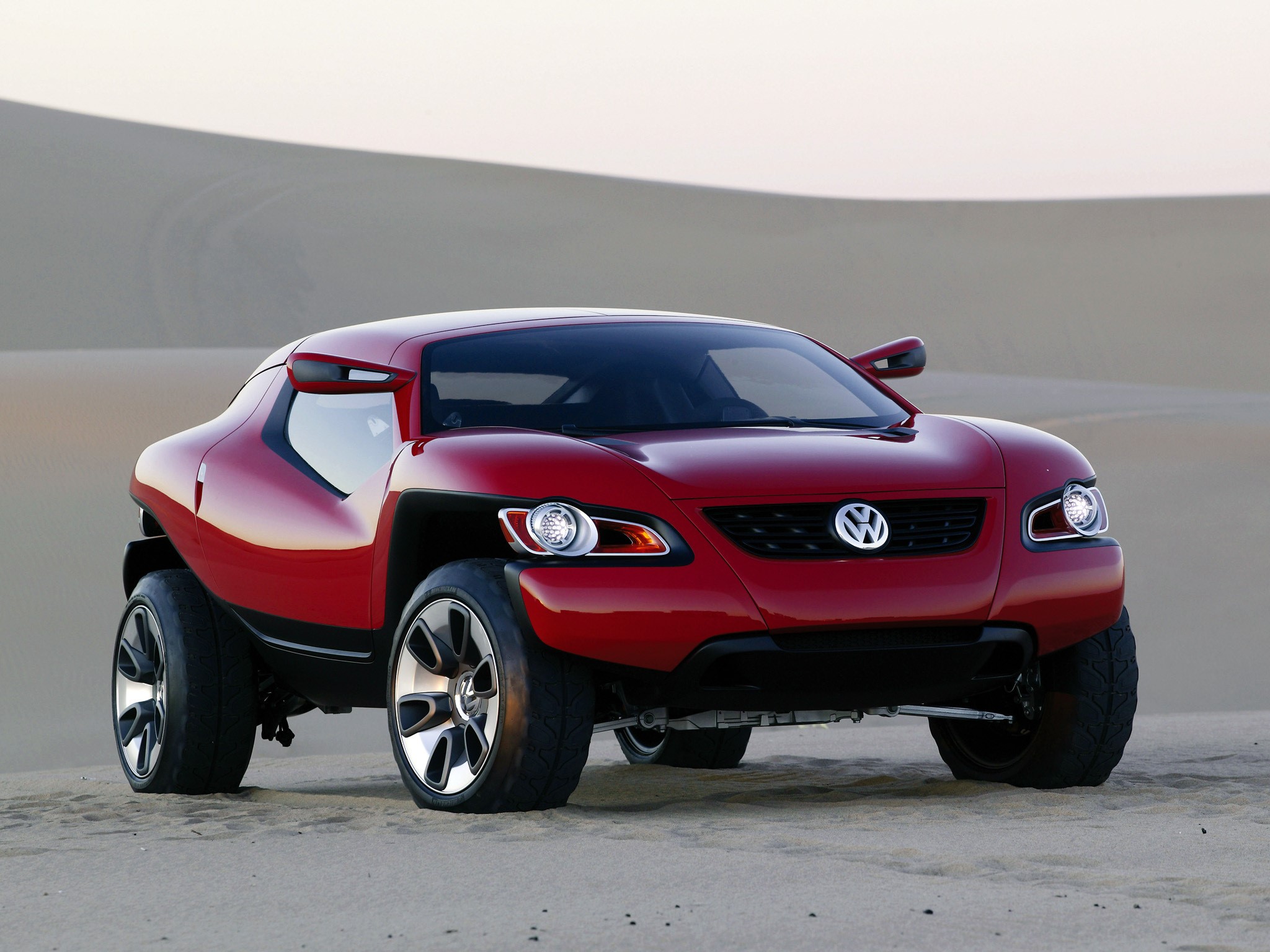 Red Volkswagen concept car in desert dunes HD Wallpaper