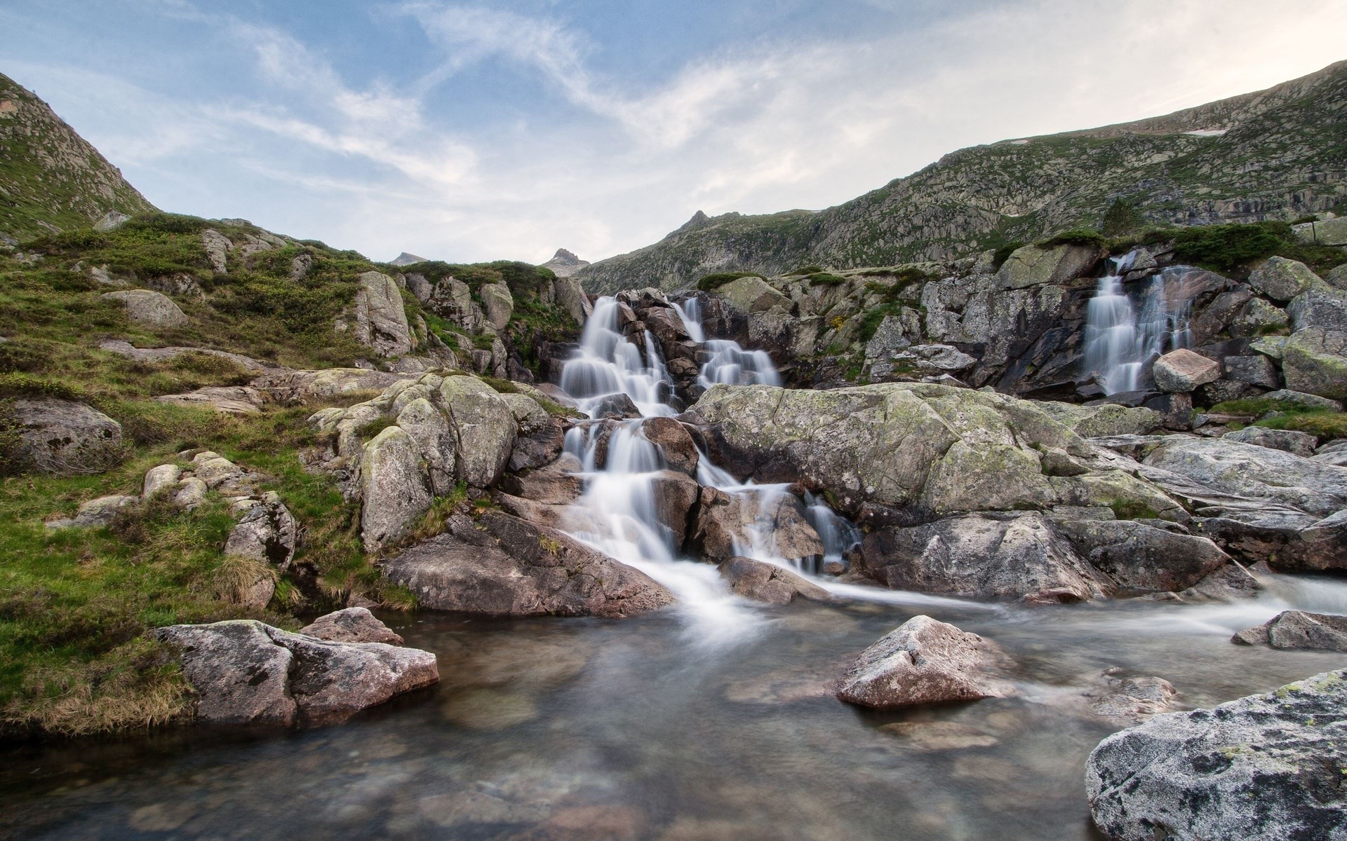 Rocky mountain waterfall with clear sky HD Wallpaper
