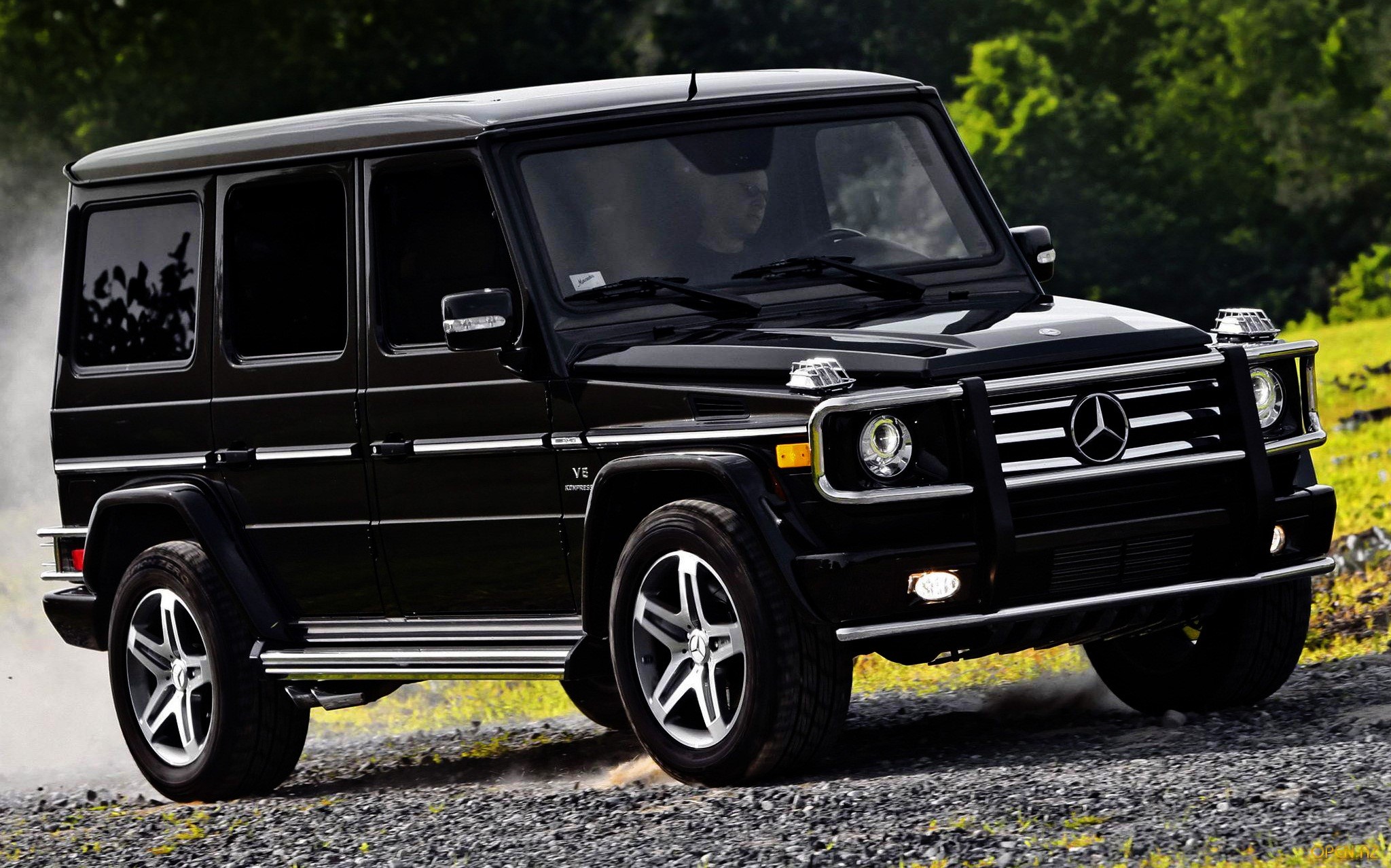 Black Mercedes-Benz G-Wagon driving on a dirt road HD Wallpaper