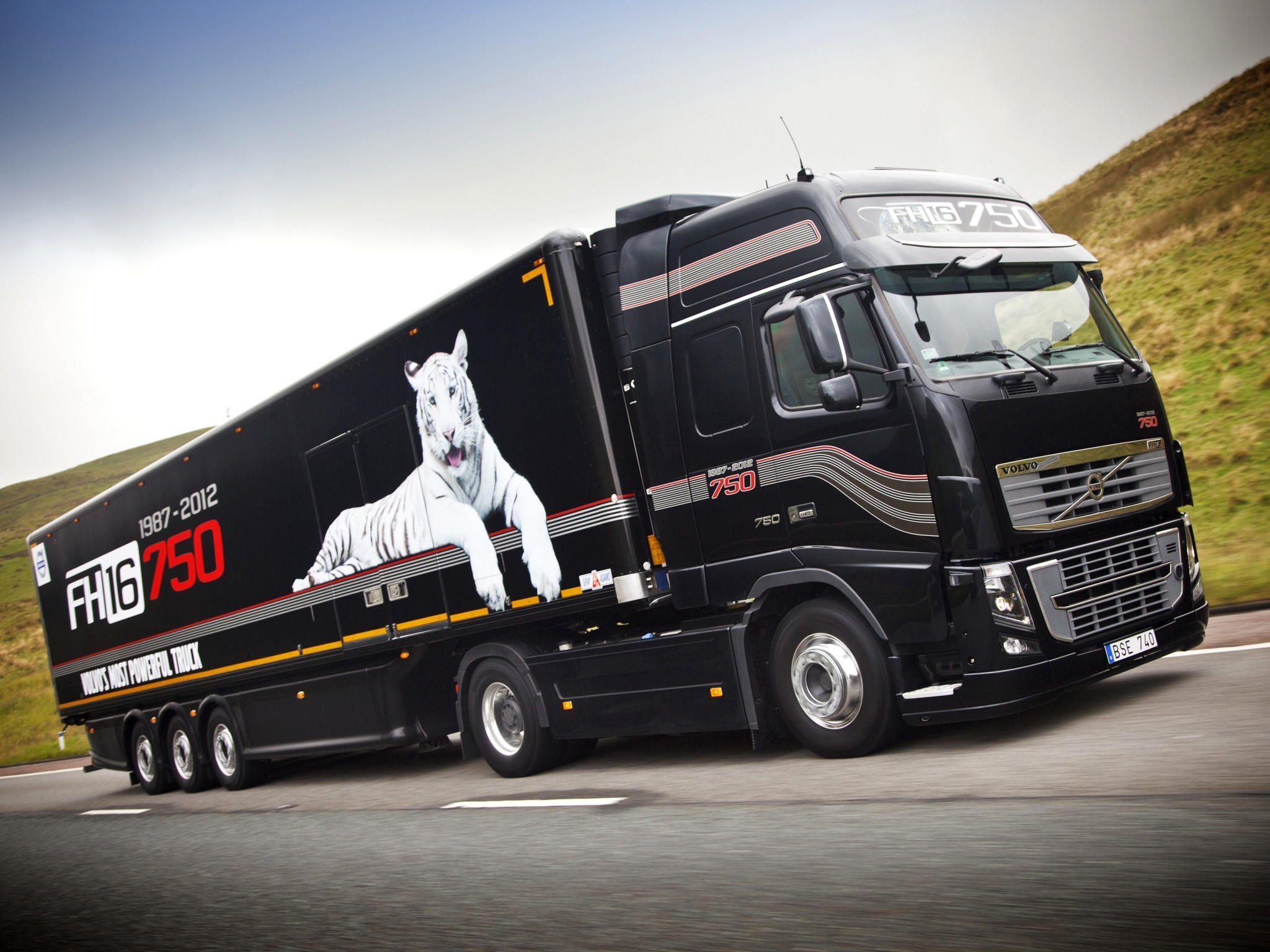 Black Volvo FH16 750 truck with white tiger graphic HD Wallpaper