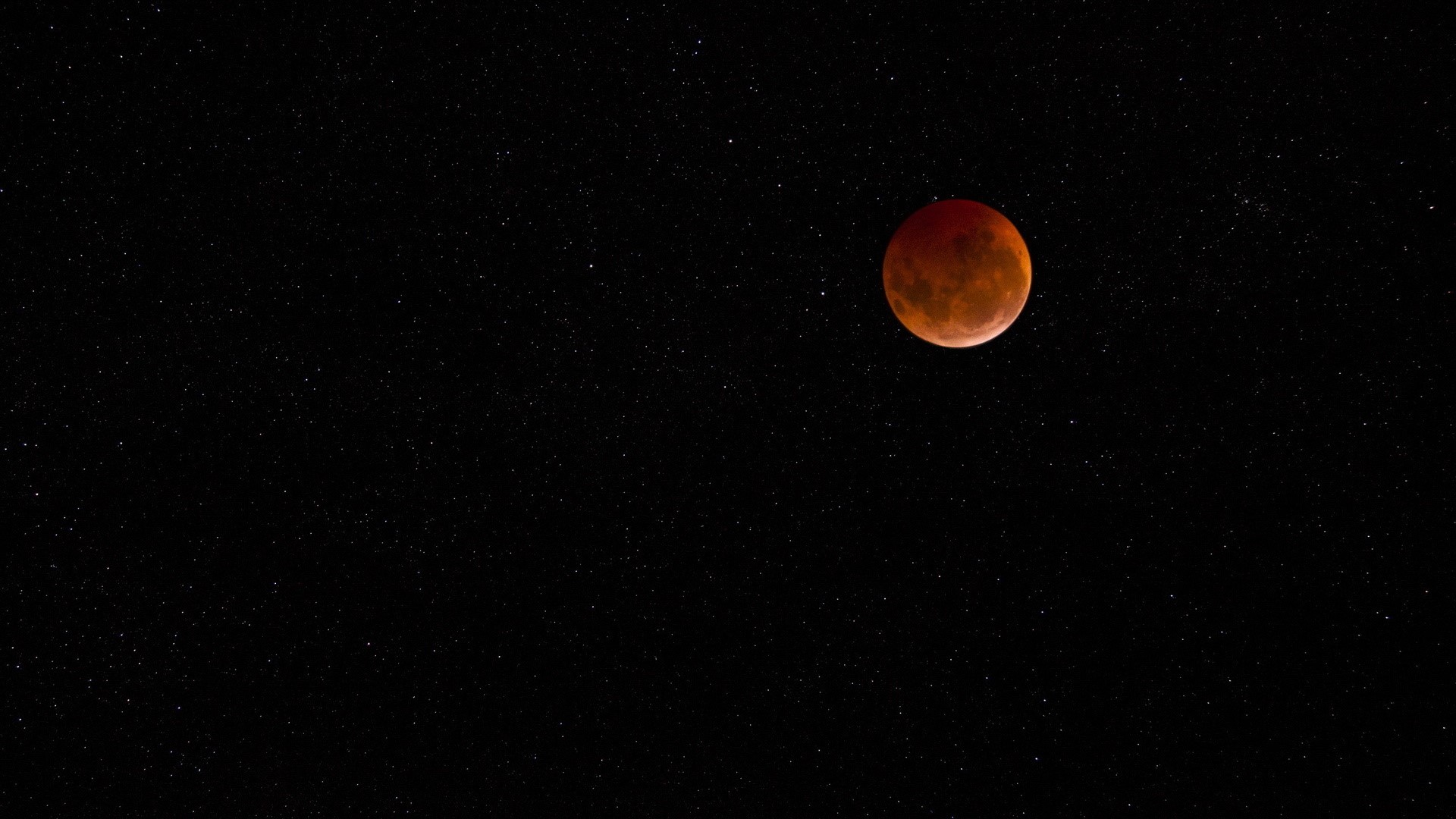 Red moon in a starry night sky HD Wallpaper
