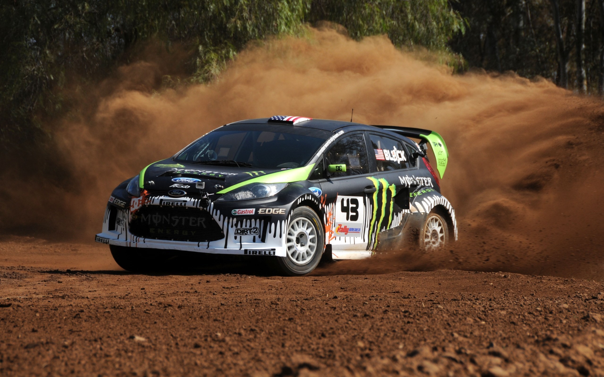 Ken Block's Ford Fiesta rally car kicking up dust HD Wallpaper