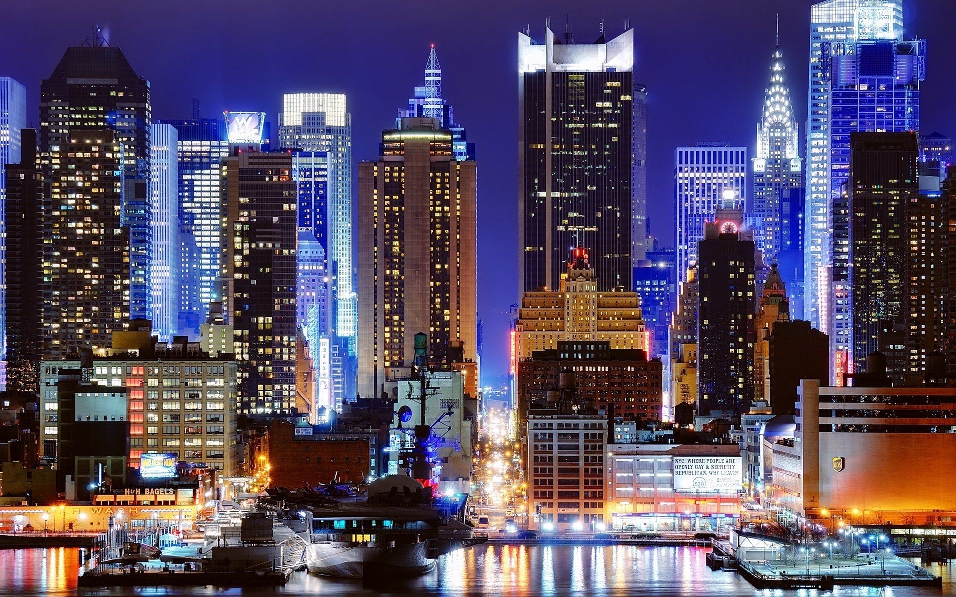 New York City skyline at night with illuminated skyscrapers HD Wallpaper