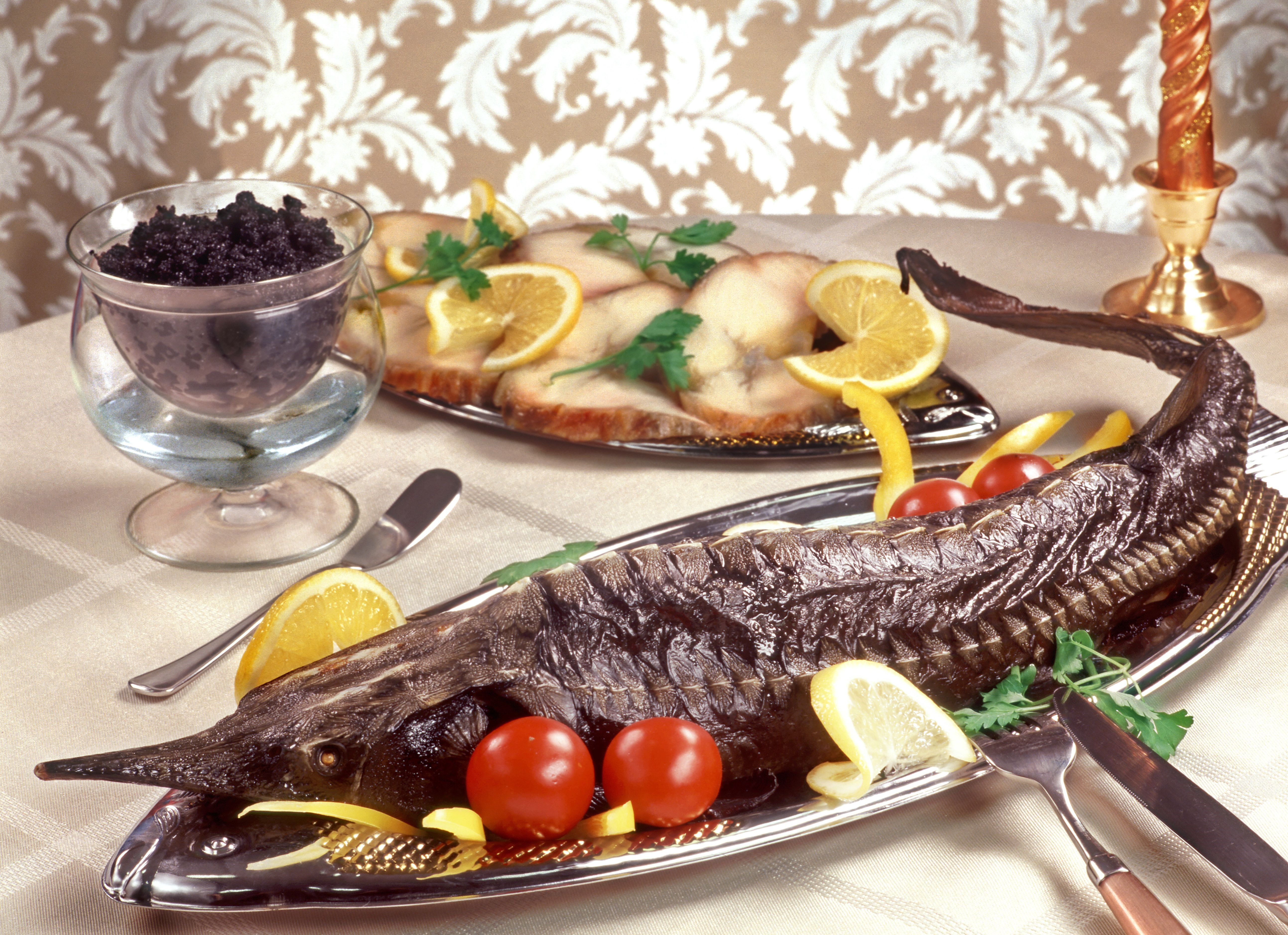 Whole smoked sturgeon with caviar and sliced fish HD Wallpaper