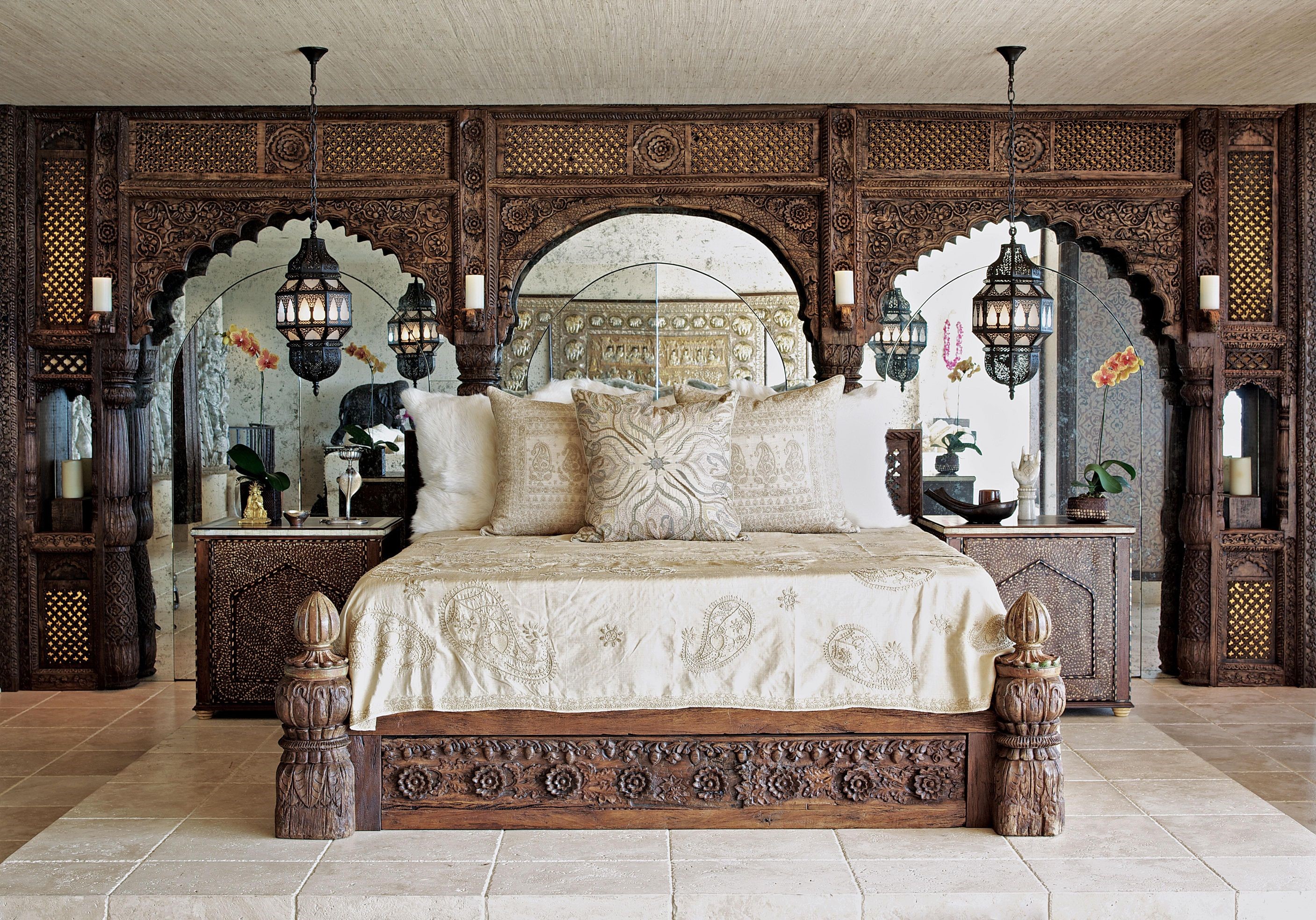 Ornate wooden bed with intricate carvings and hanging lanterns HD Wallpaper