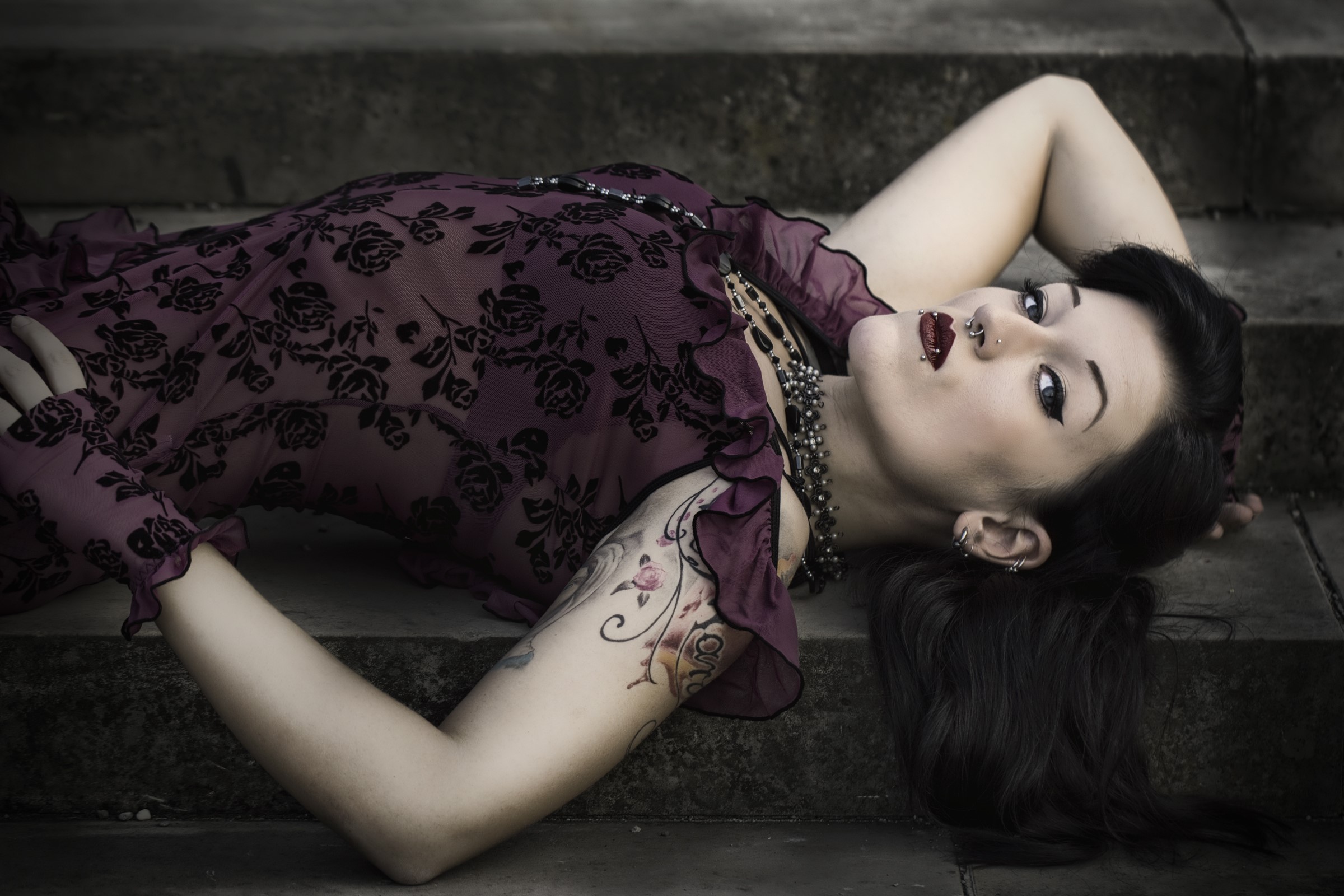 Woman in a floral dress lying on steps HD Wallpaper