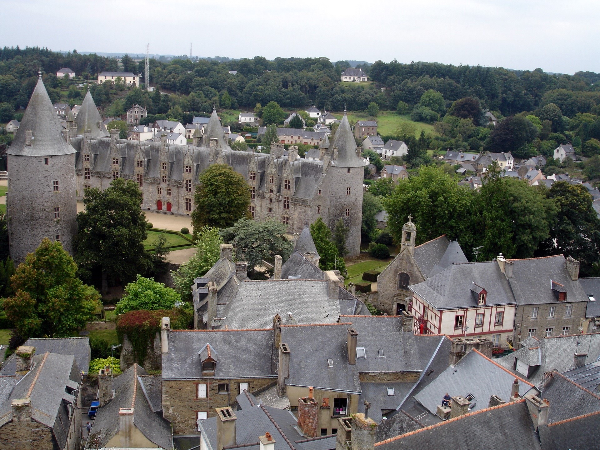Castle in a French village with surrounding forest HD Wallpaper