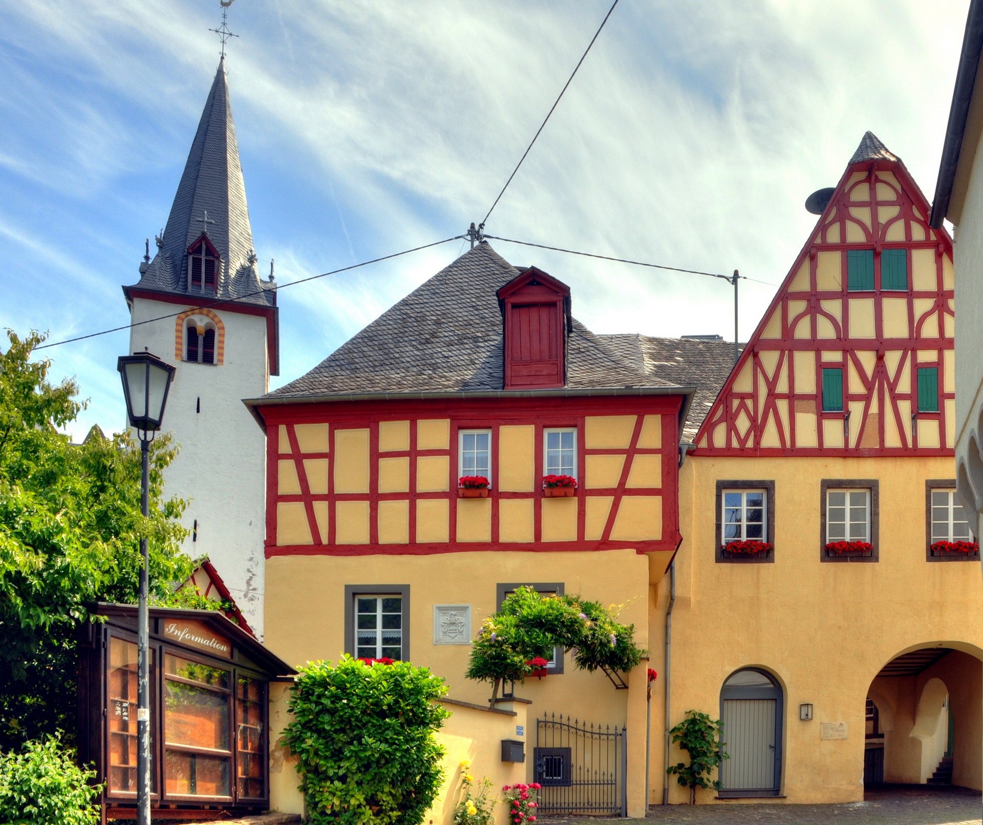 Half-timbered houses and church tower in Germany HD Wallpaper