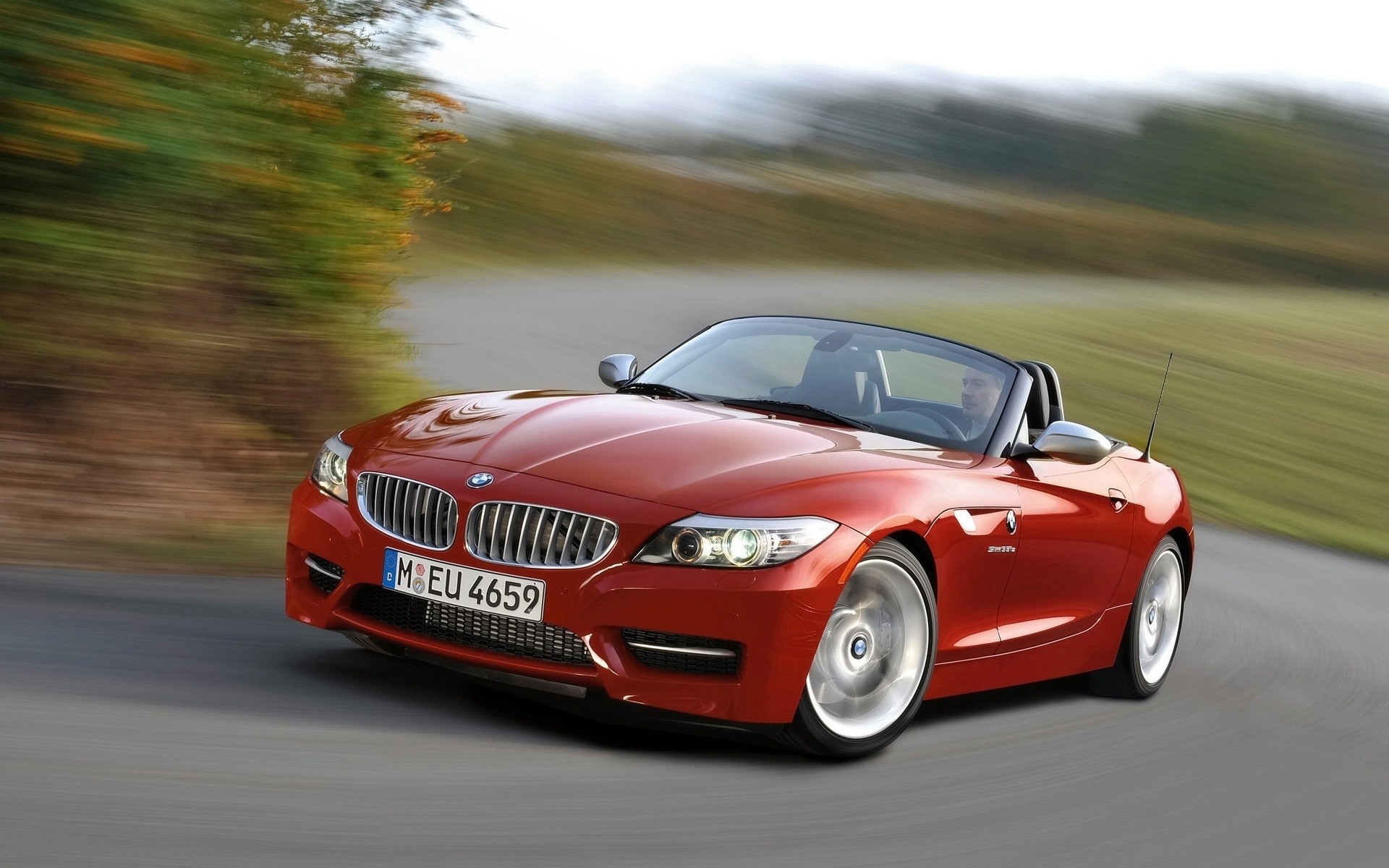 Red BMW Z4 Convertible Driving on a Road HD Wallpaper