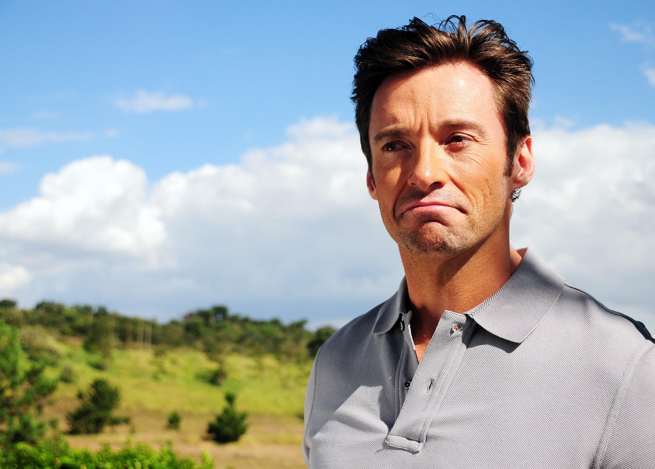 Hugh Jackman wearing a grey polo shirt HD Wallpaper