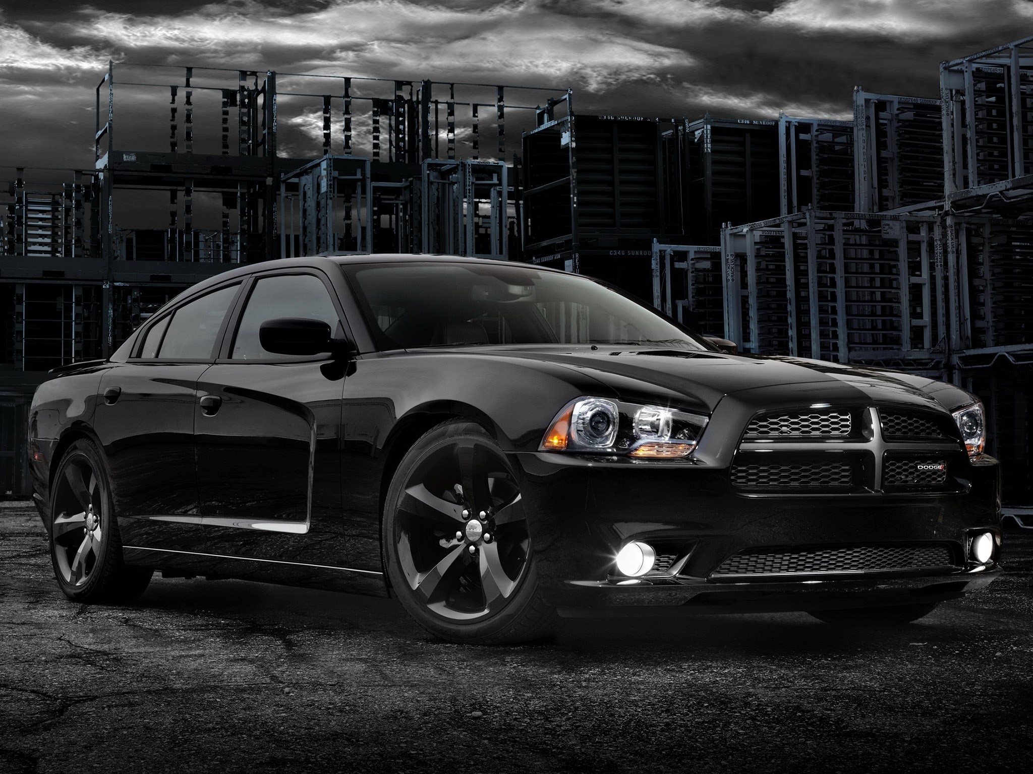 Black Dodge Charger parked in industrial area HD Wallpaper