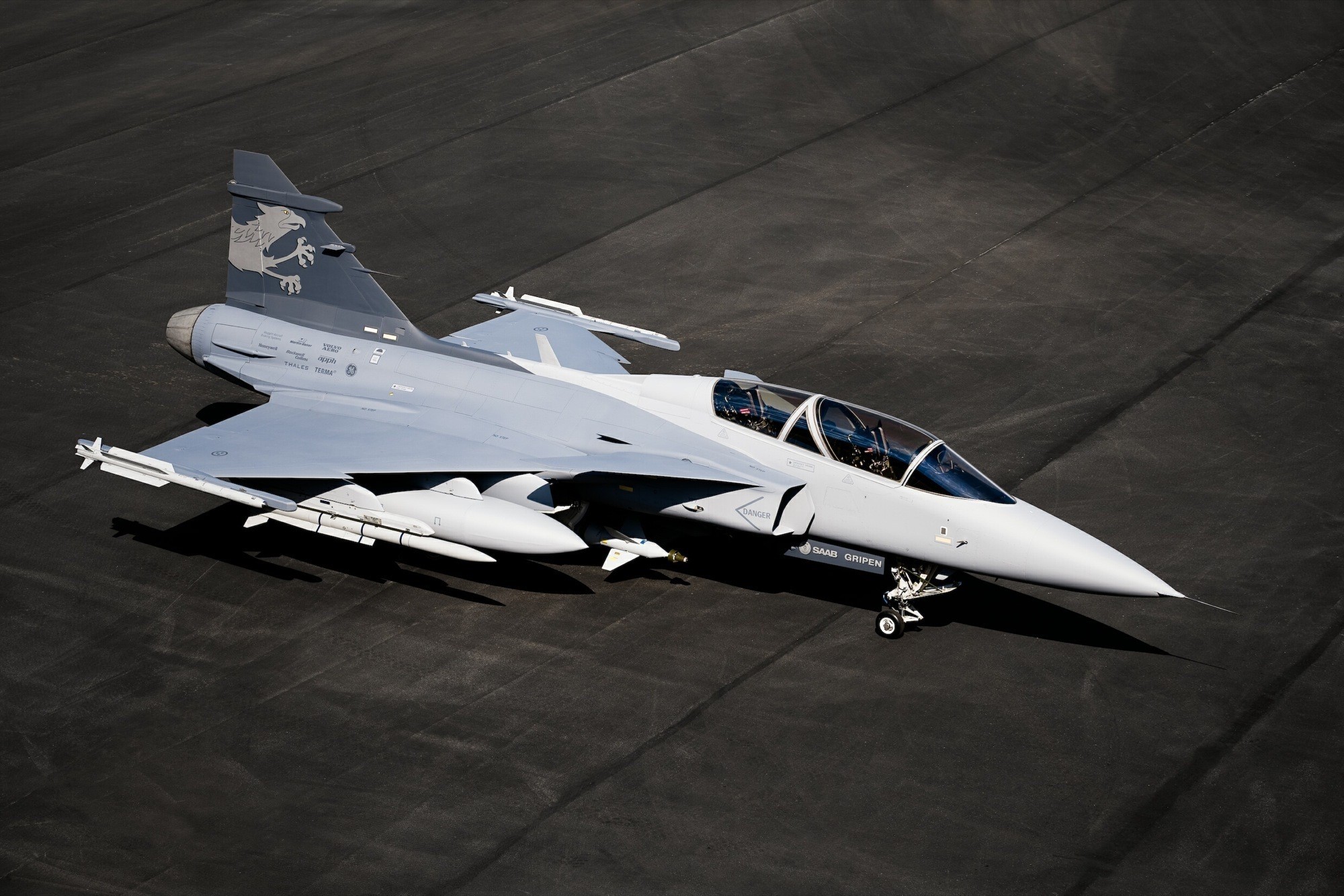 Saab JAS 39 Gripen fighter jet on tarmac HD Wallpaper