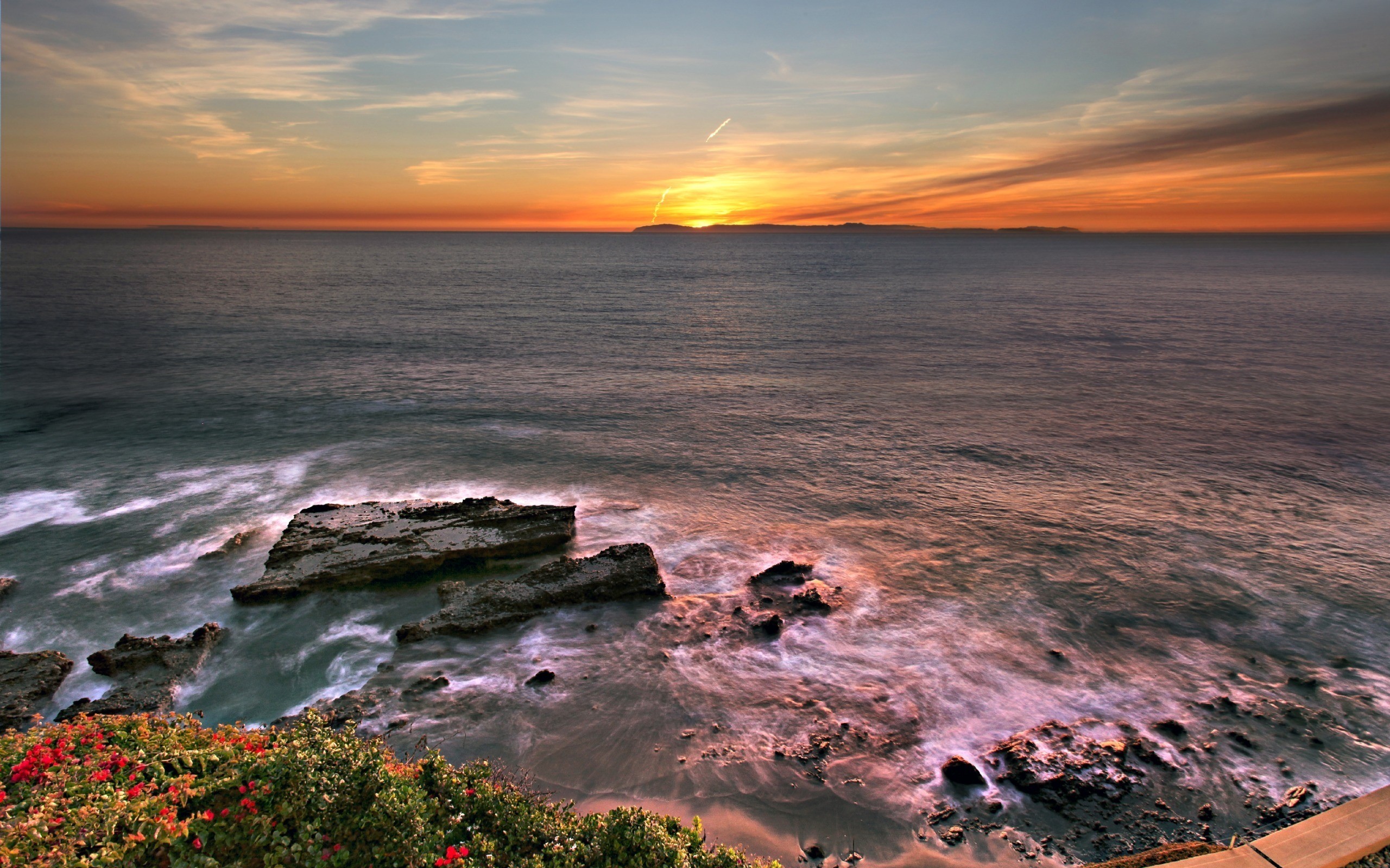 Sunset over the ocean with islands on the horizon HD Wallpaper