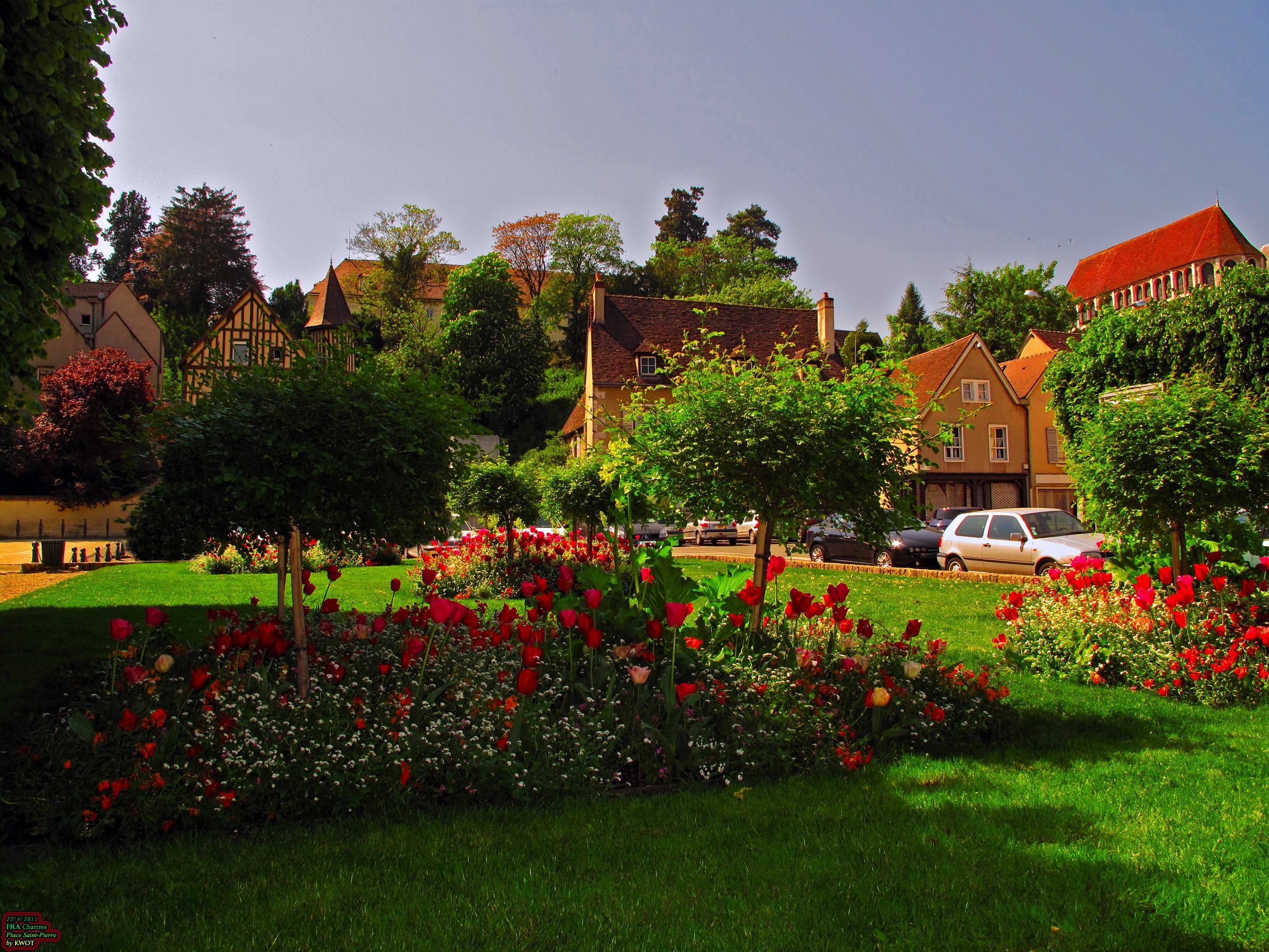 Flower garden with houses and trees in France HD Wallpaper