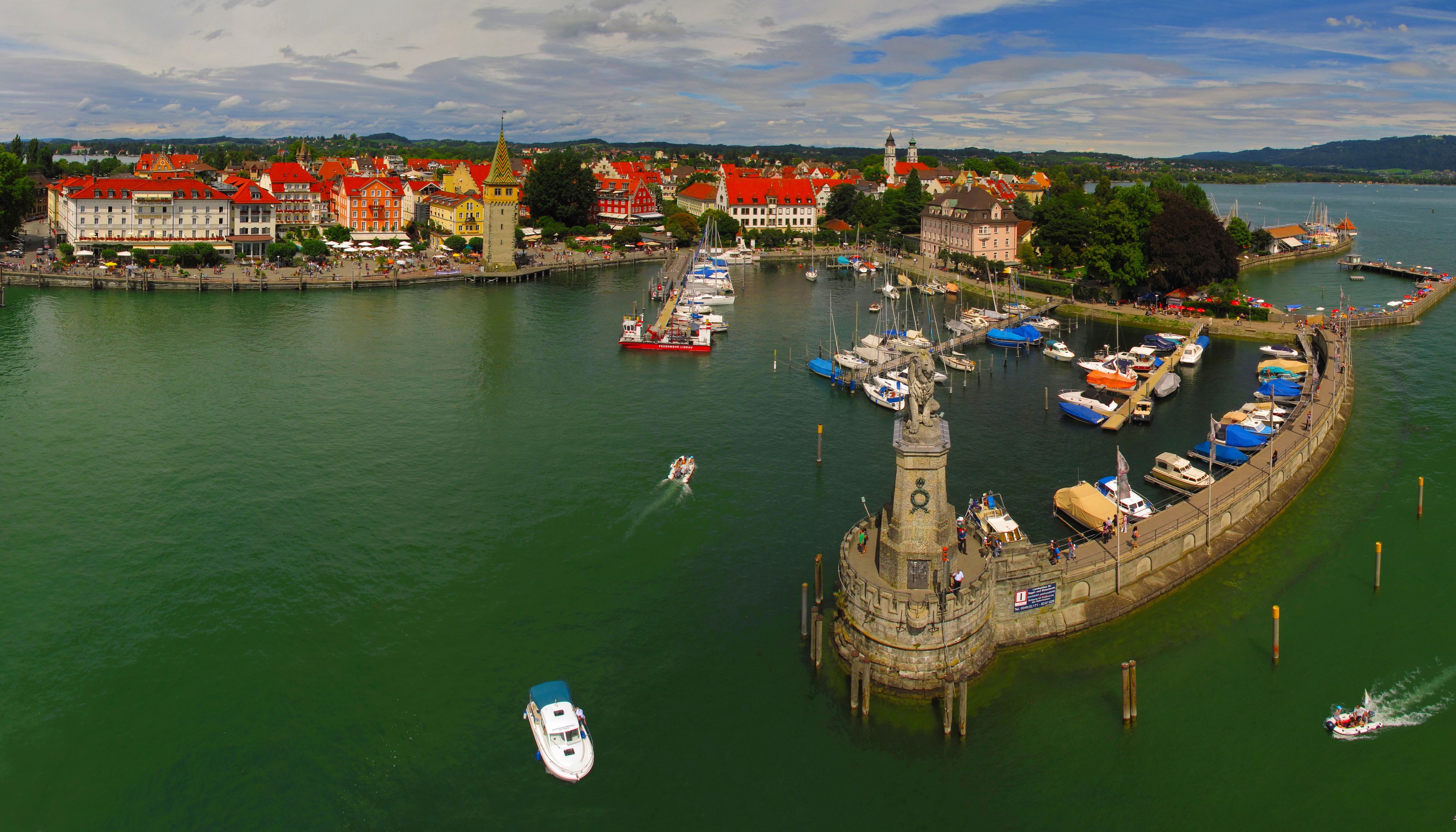 Lindau Harbor with Lighthouse and Cityscape, Germany HD Wallpaper