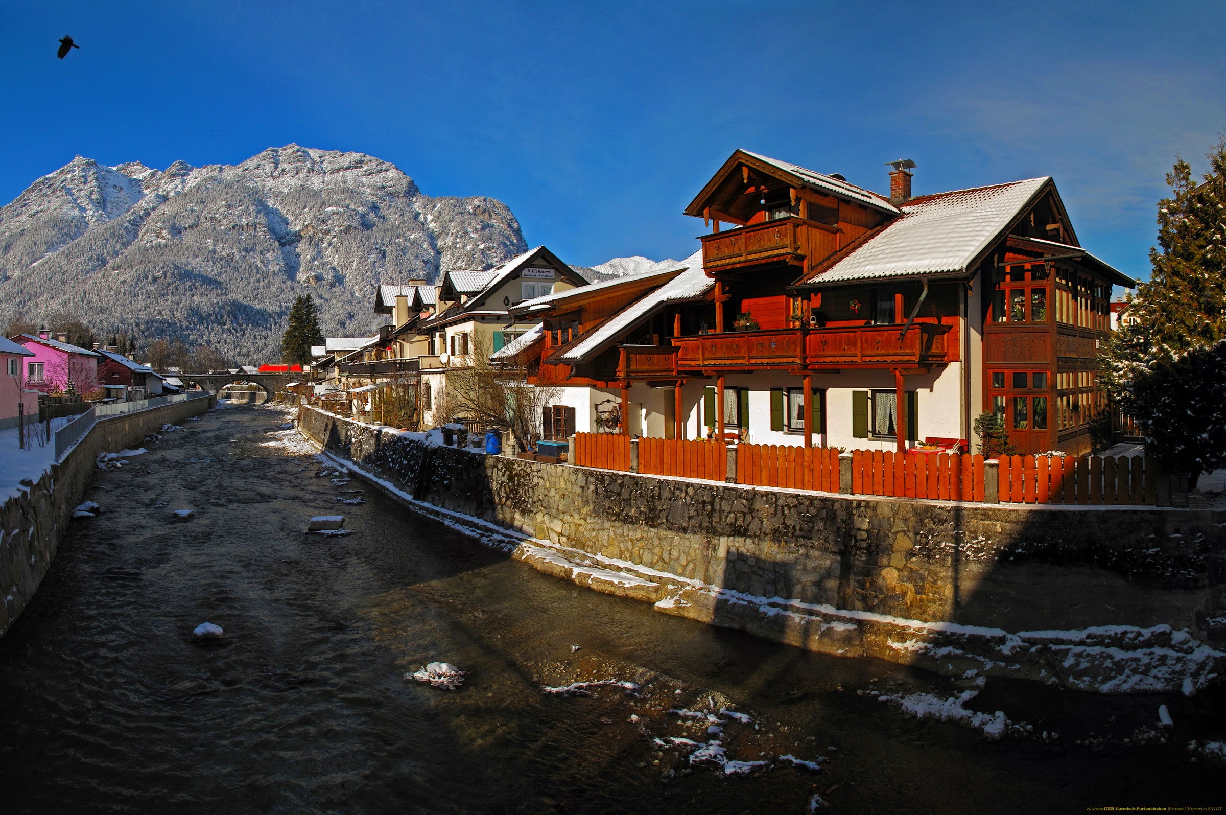River in a snowy German town with mountains HD Wallpaper