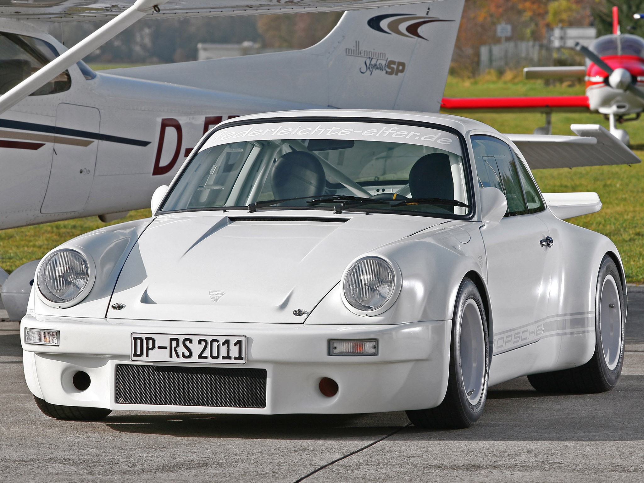 White Porsche 911 with airplanes in background HD Wallpaper