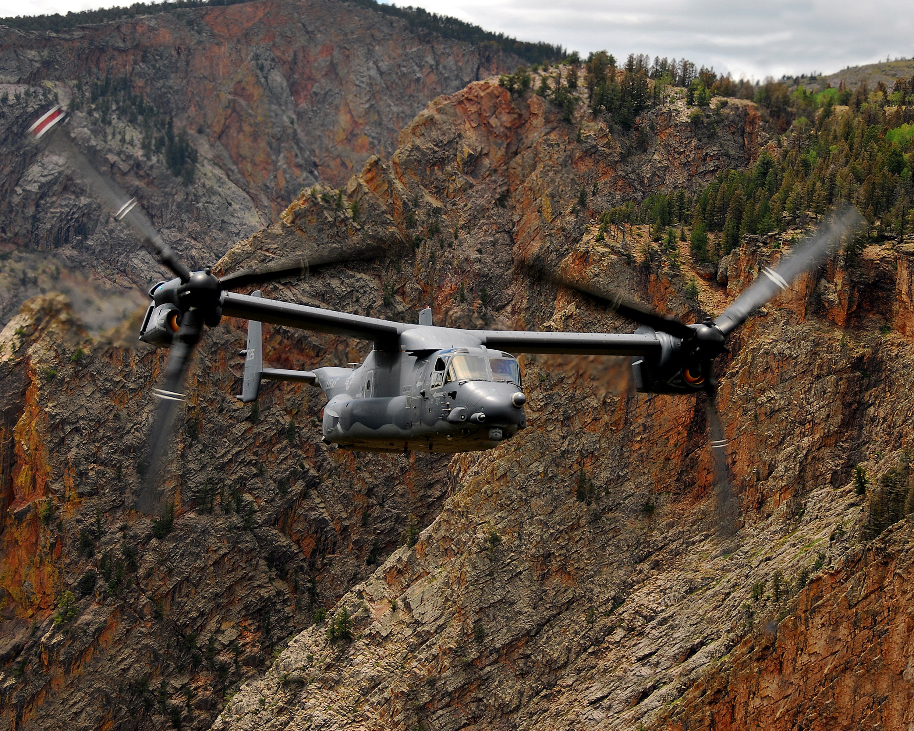V-22 Osprey Convertiplane flying through a canyon HD Wallpaper