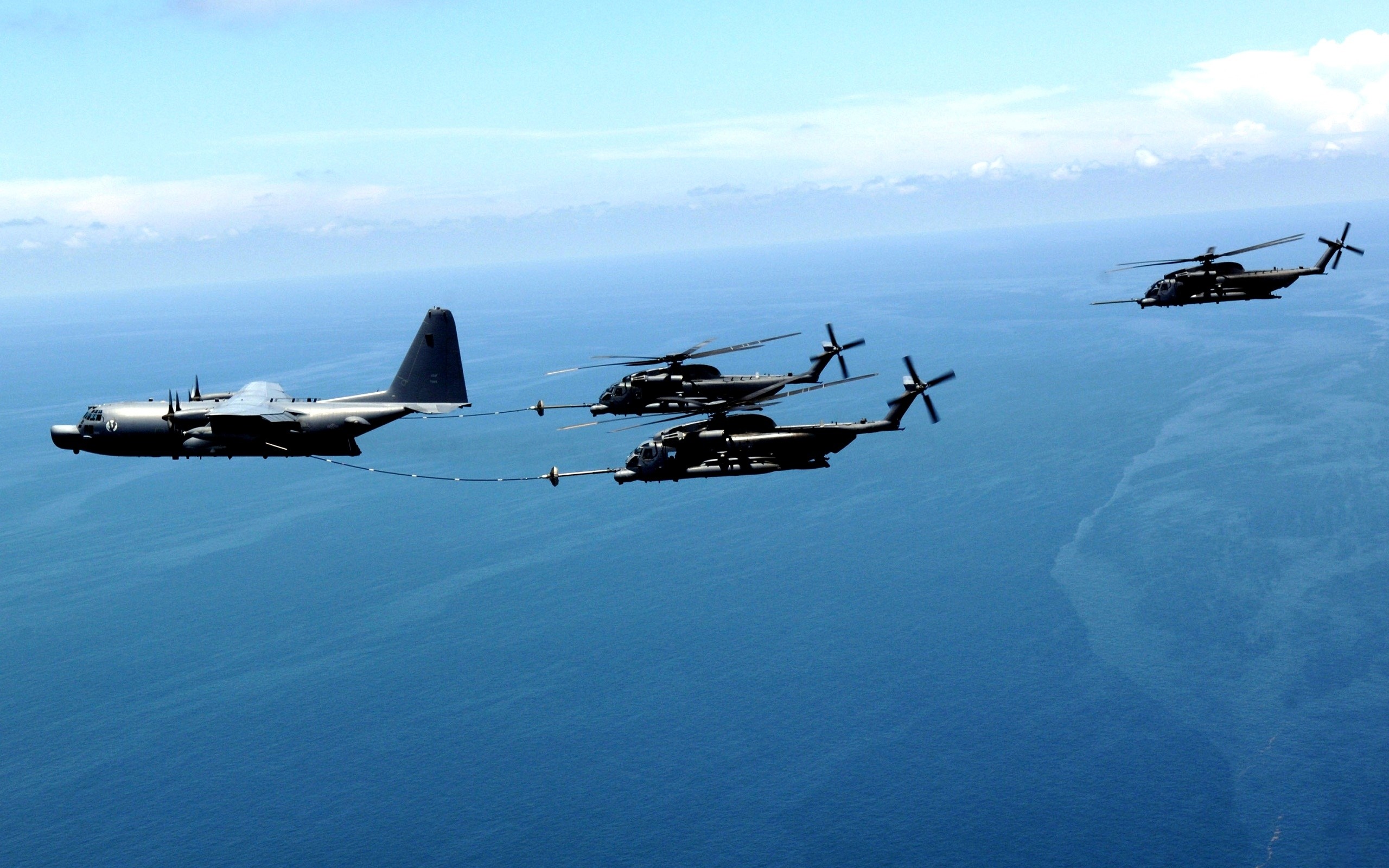 KC-130J Hercules refuels MH-53M Pave Low helicopters HD Wallpaper