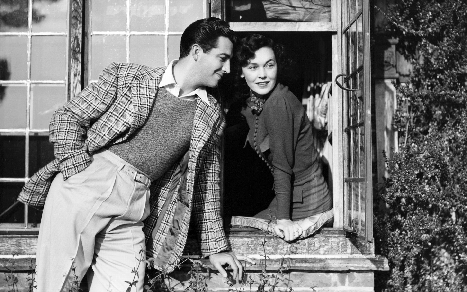 Man and woman by a window HD Wallpaper