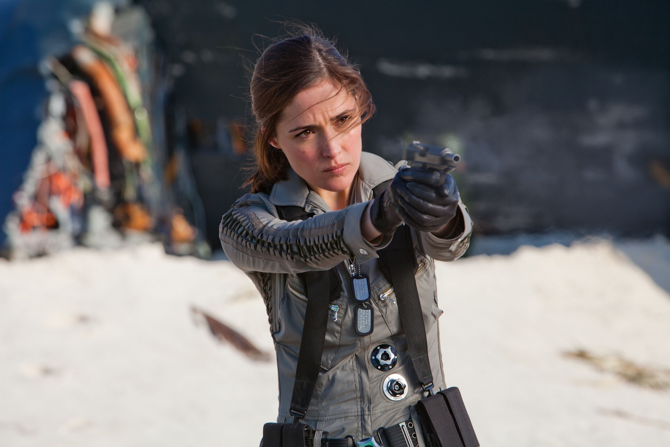 Woman in uniform holding a gun HD Wallpaper