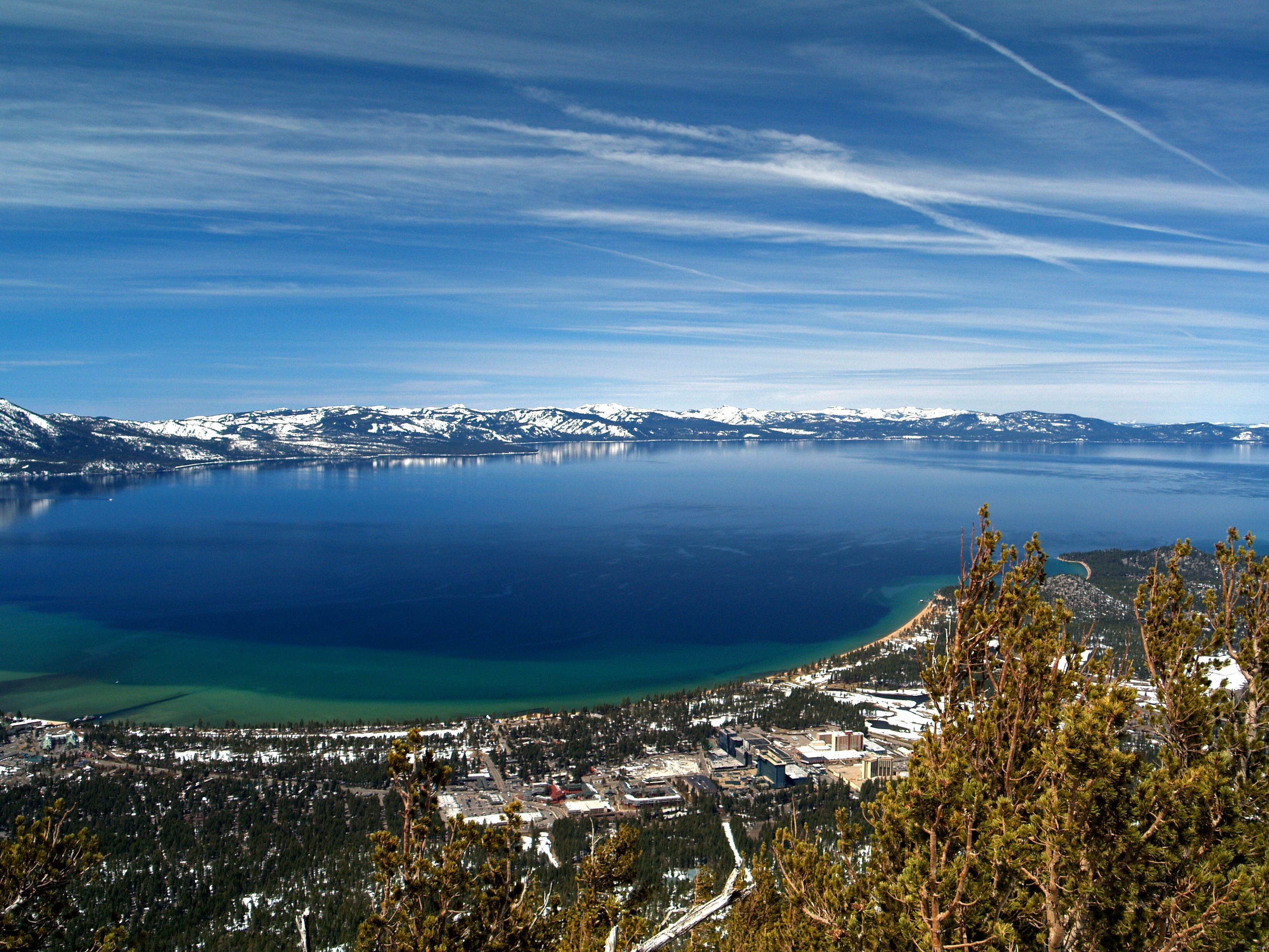 Lake Tahoe with snow-capped mountains and trees HD Wallpaper