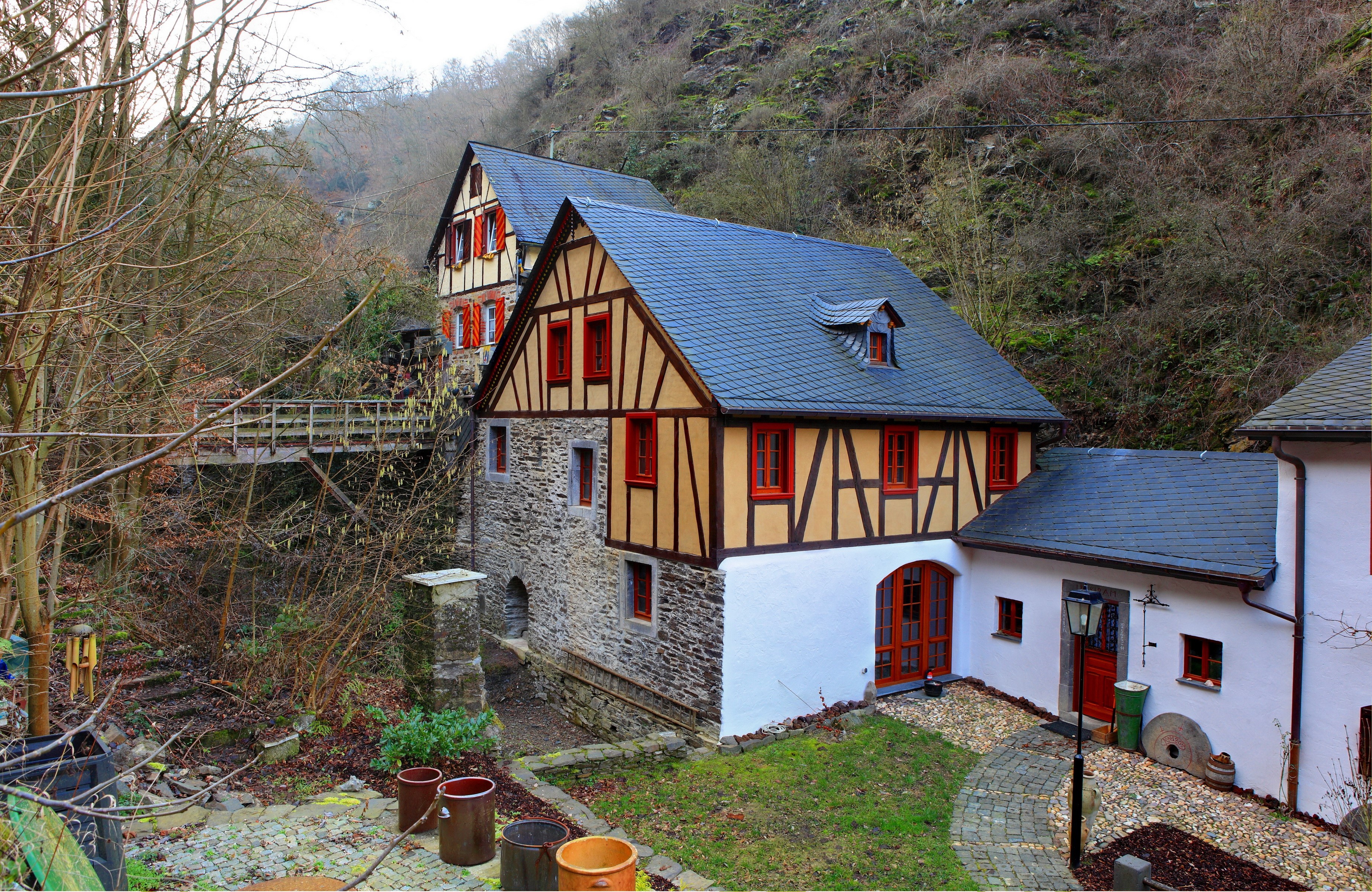 Half-timbered houses in a wooded valley in Germany HD Wallpaper