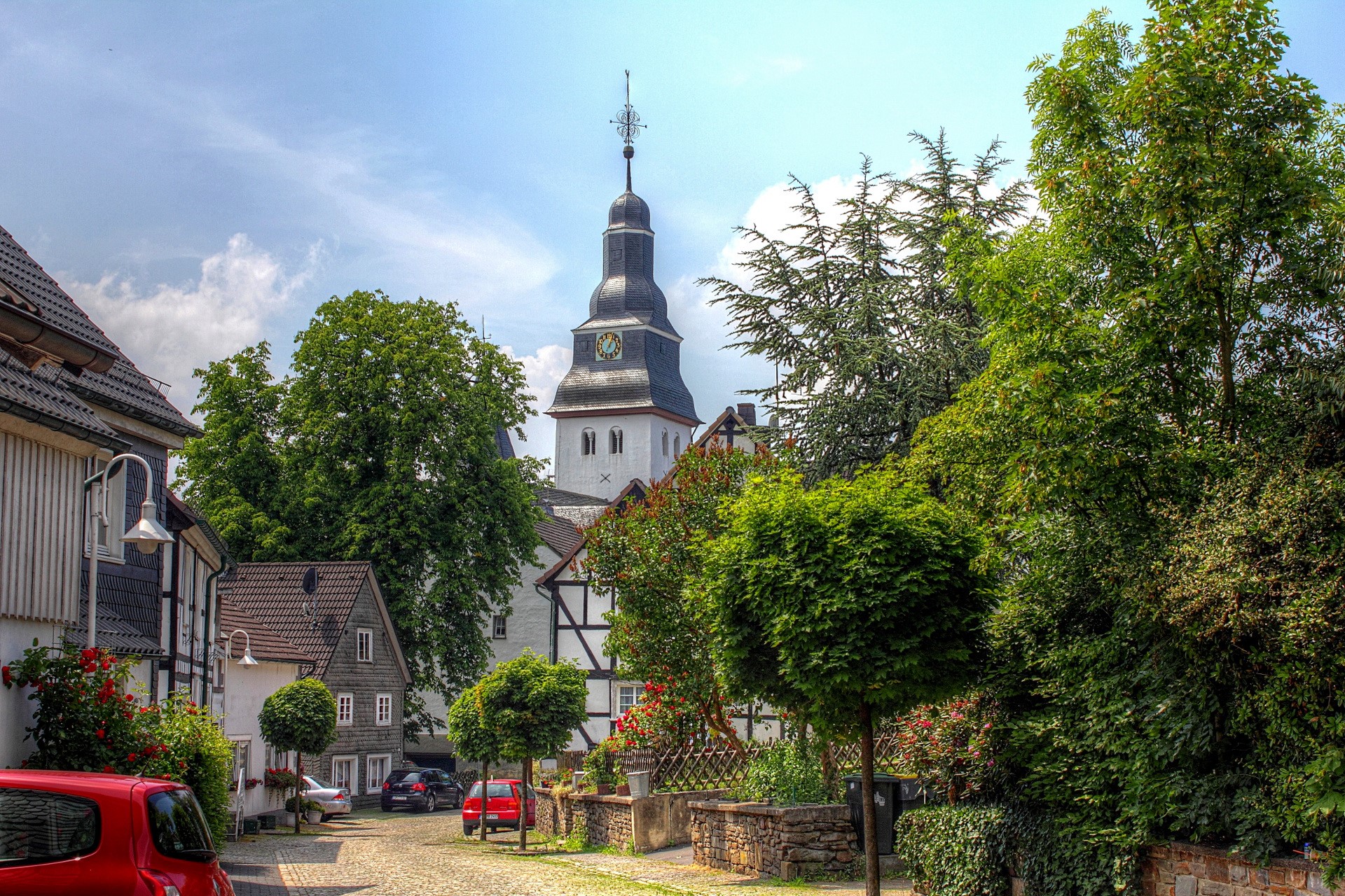 Street in a German town with a church tower HD Wallpaper