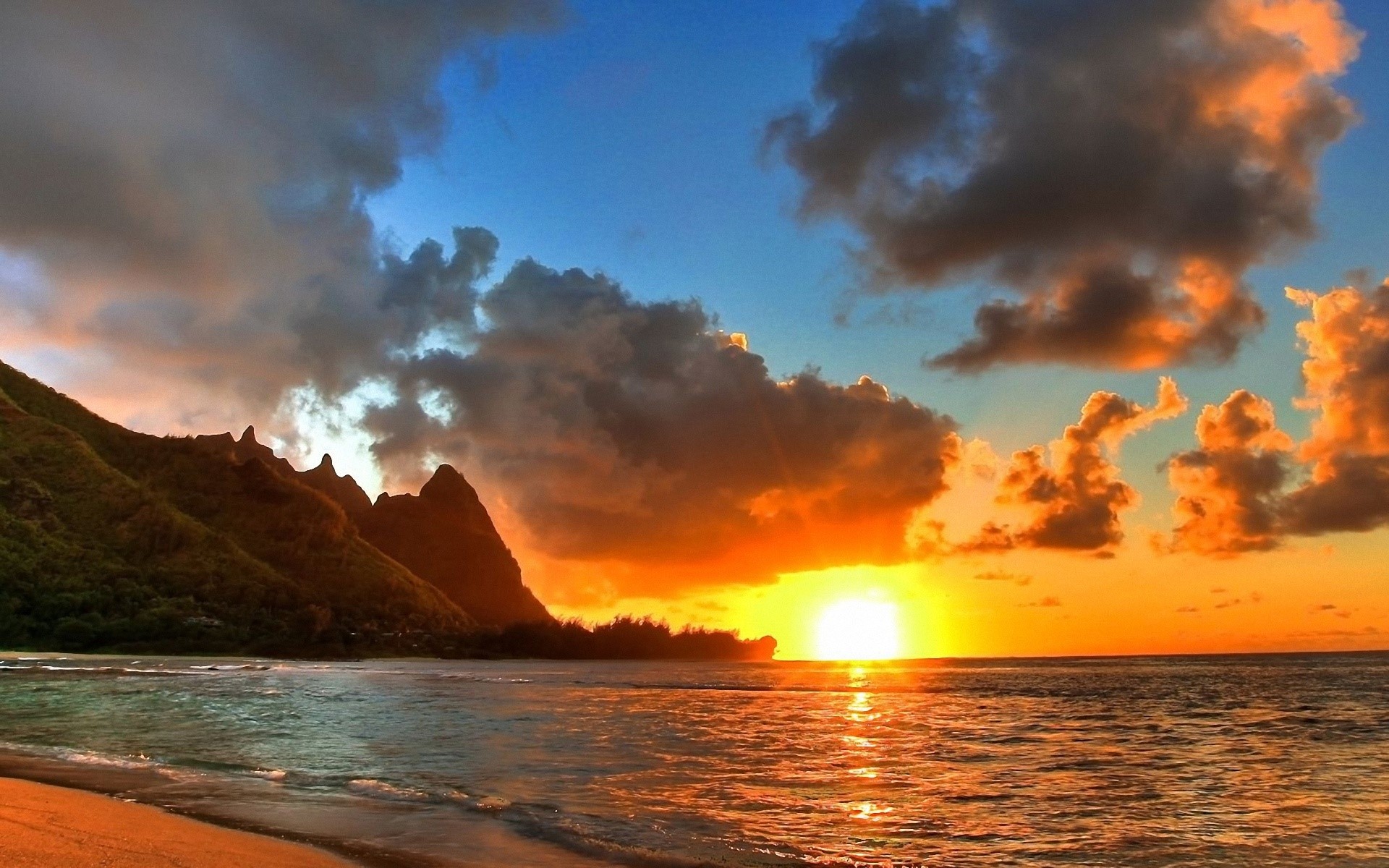 Sunset over the ocean with mountains and clouds HD Wallpaper