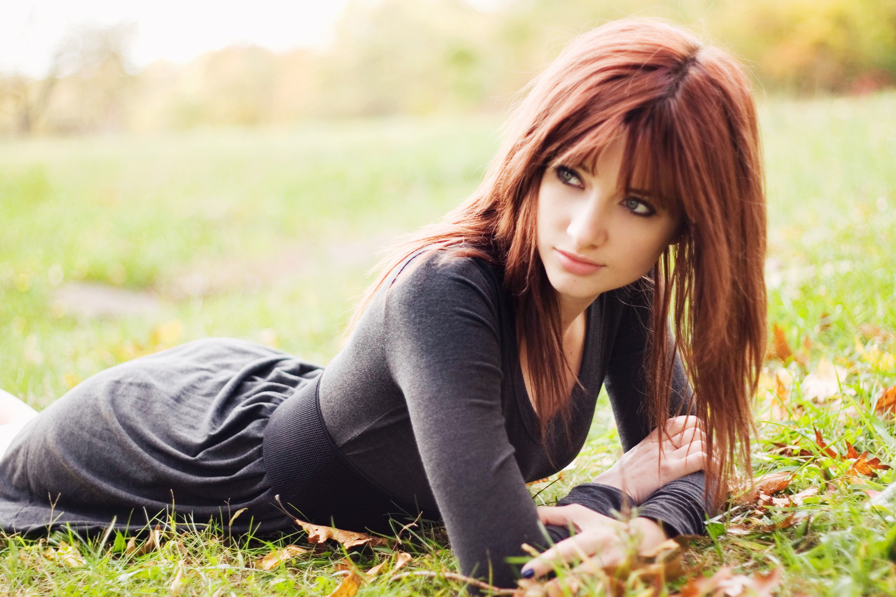 Susan Coffey lying on grass HD Wallpaper