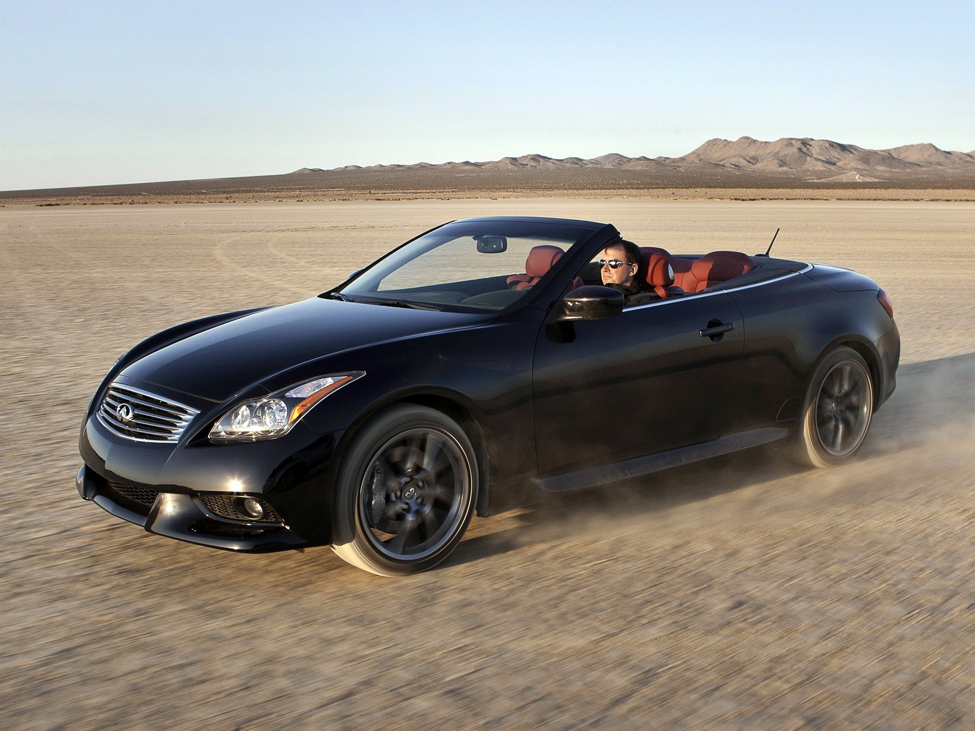 Black Infiniti Convertible Driving in Desert HD Wallpaper