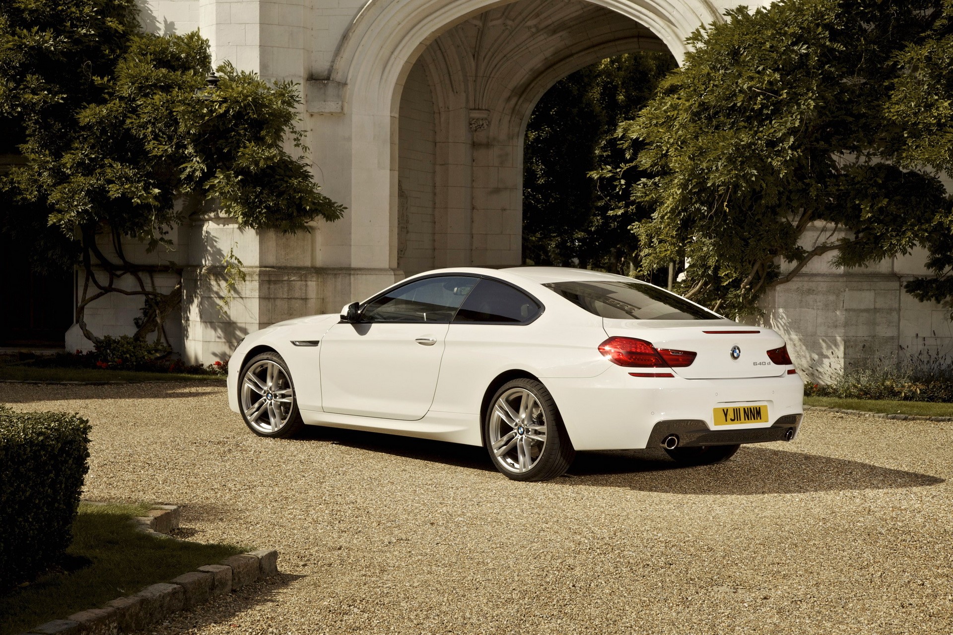 White BMW 640d Coupe parked near an archway HD Wallpaper