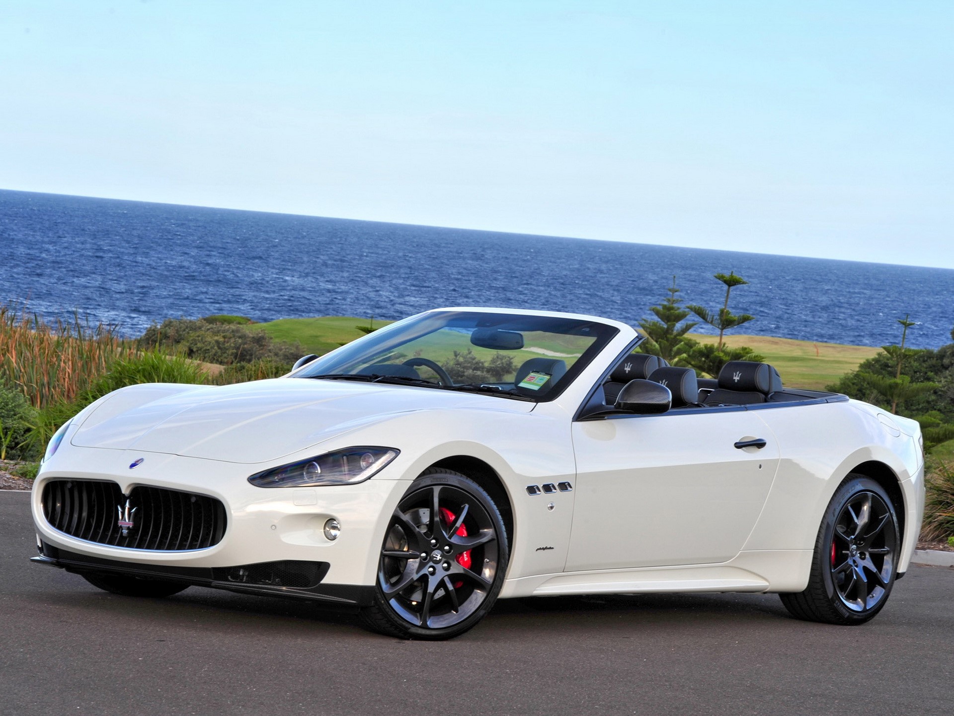 White Maserati GranCabrio convertible by the ocean HD Wallpaper