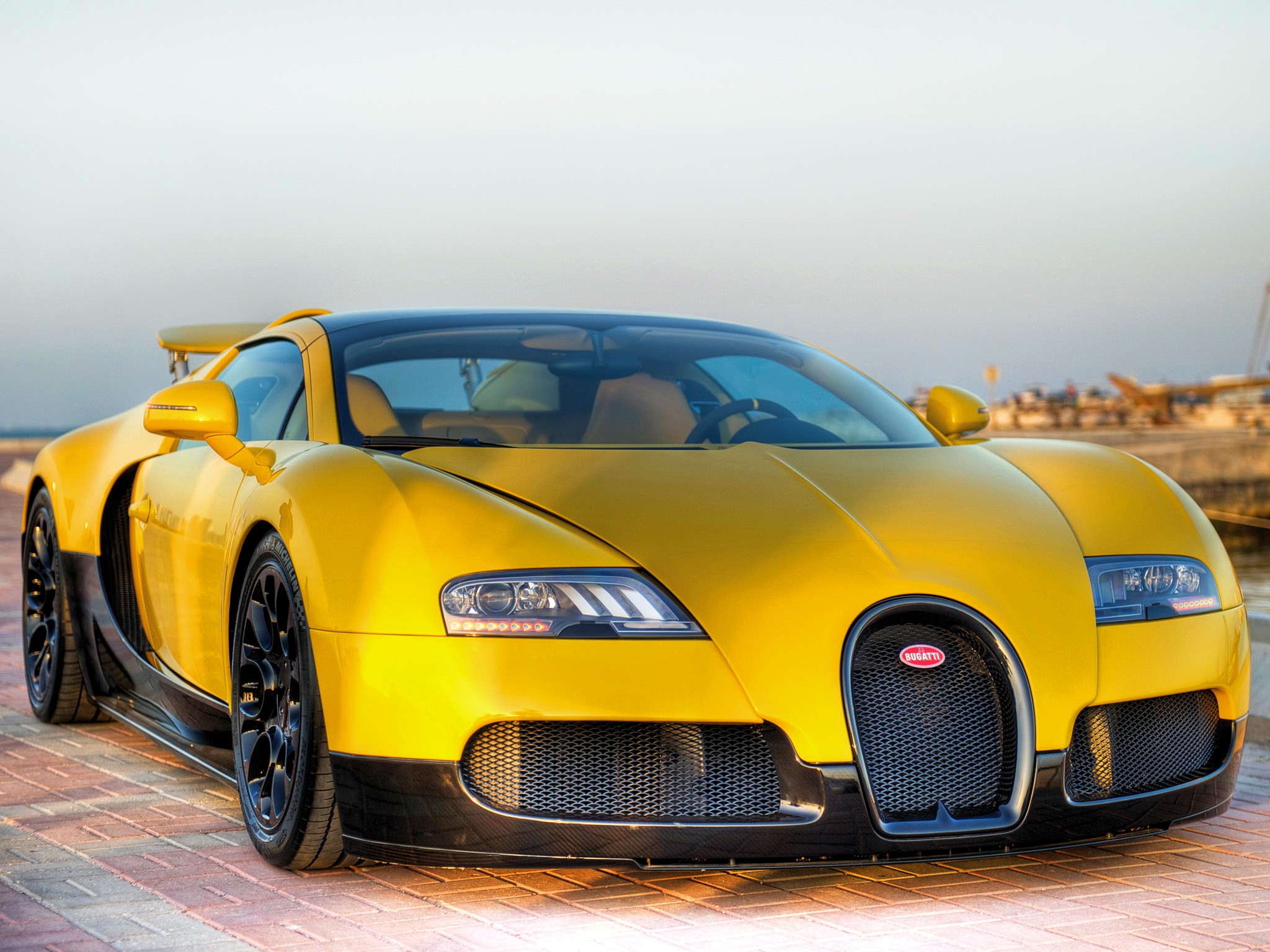 Yellow Bugatti Veyron parked by the water HD Wallpaper