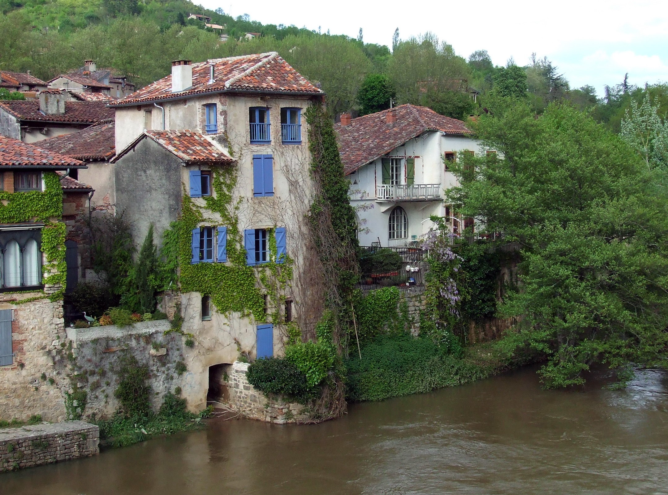 Houses on a river in Saint Antonin Noble Val, France HD Wallpaper