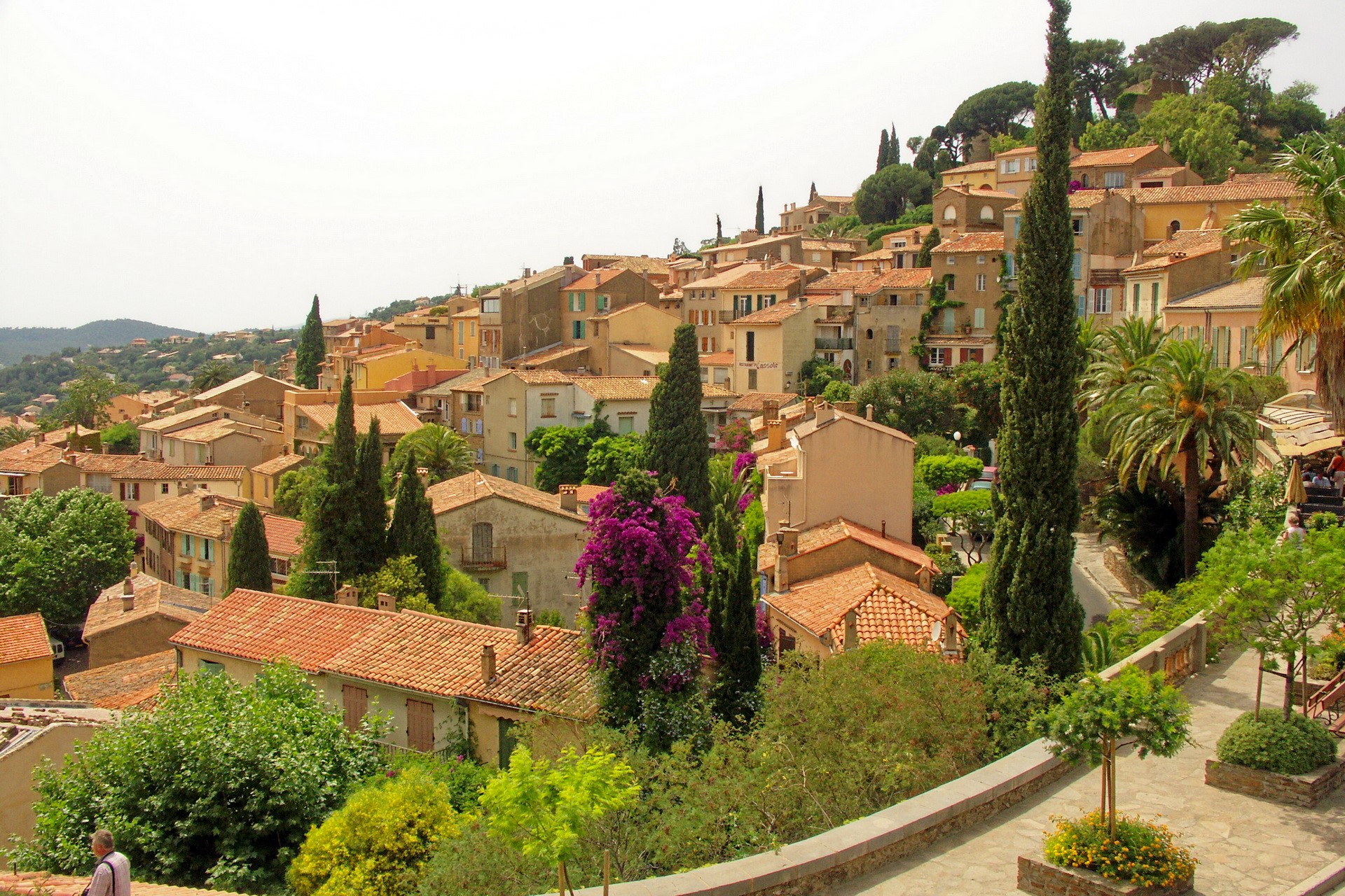 Hillside village with terracotta roofs in France HD Wallpaper