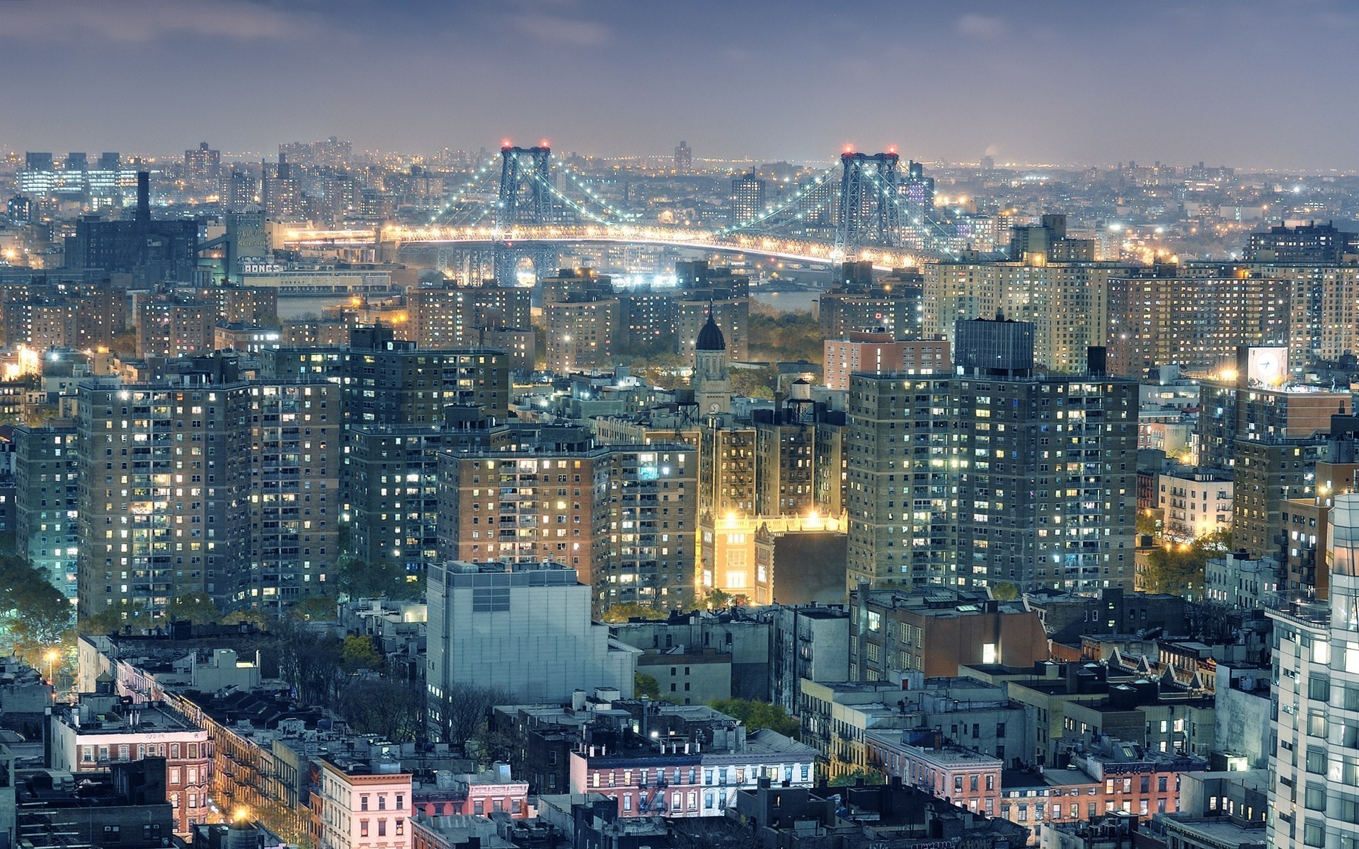 New York City skyline with bridges at night HD Wallpaper