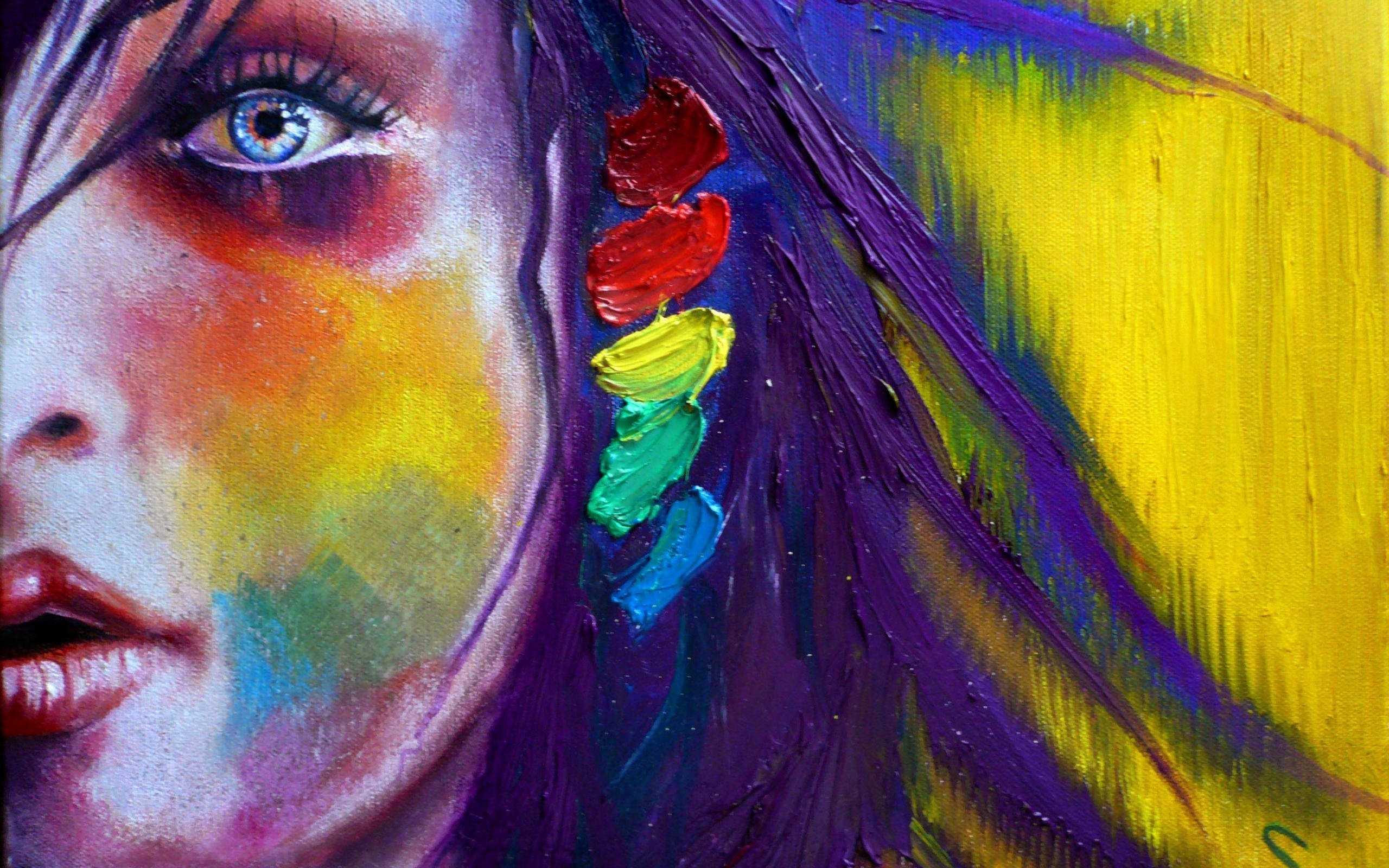 Close-up of a woman's face with rainbow paint HD Wallpaper