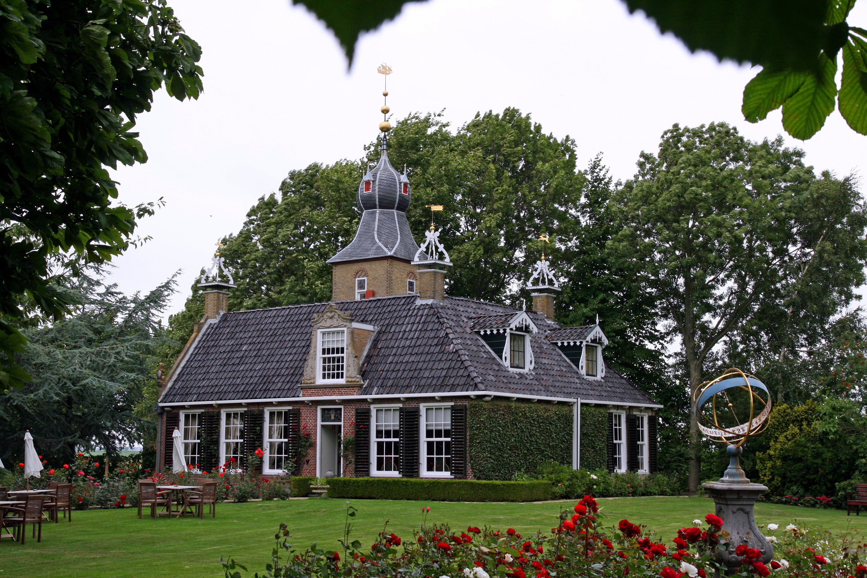 Historic building with garden and armillary sphere in Allingawier, Netherlands HD Wallpaper