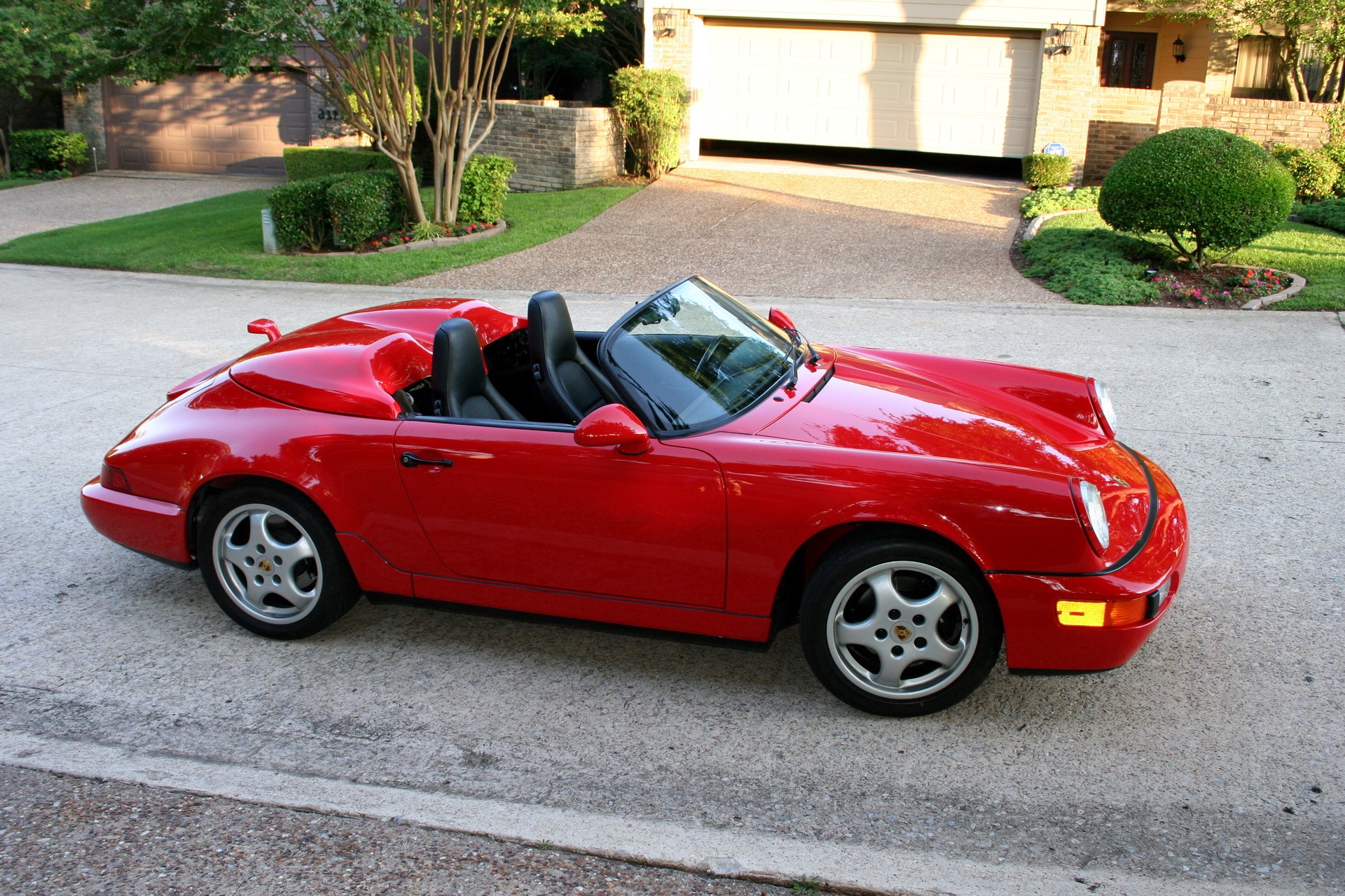 Red Porsche 911 convertible parked in driveway HD Wallpaper