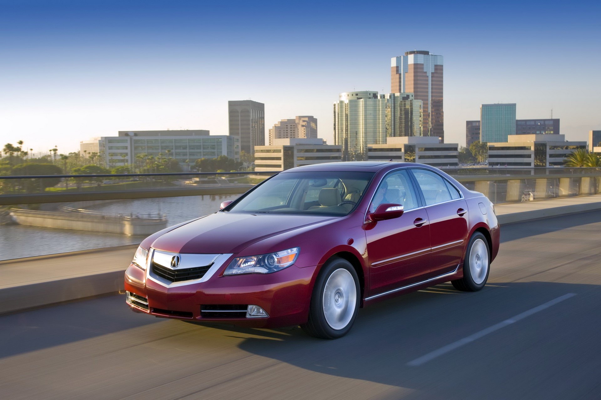 Red Acura RL Sedan Driving on a Bridge HD Wallpaper
