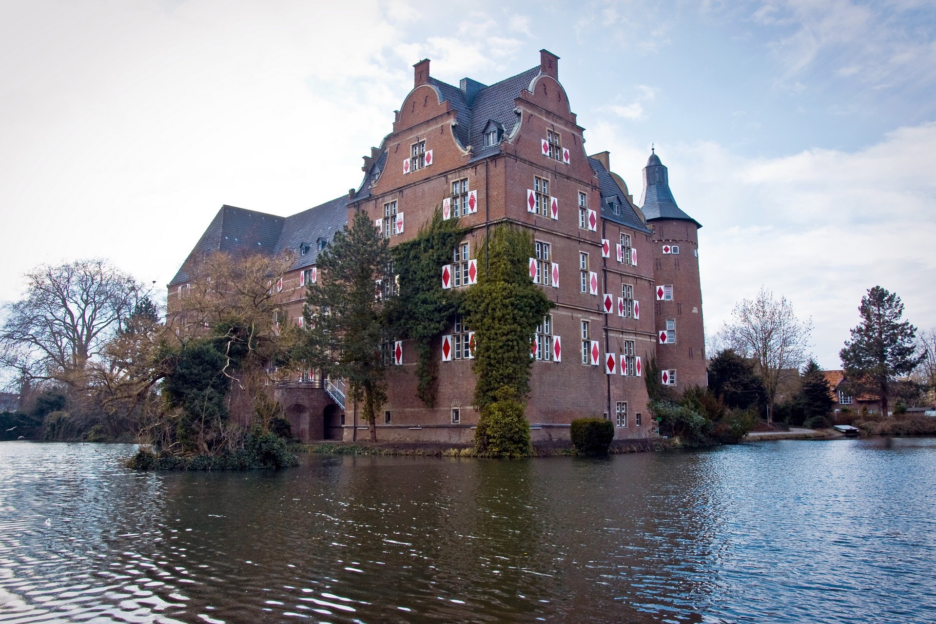 Castle Bedburg on a lake in Germany HD Wallpaper