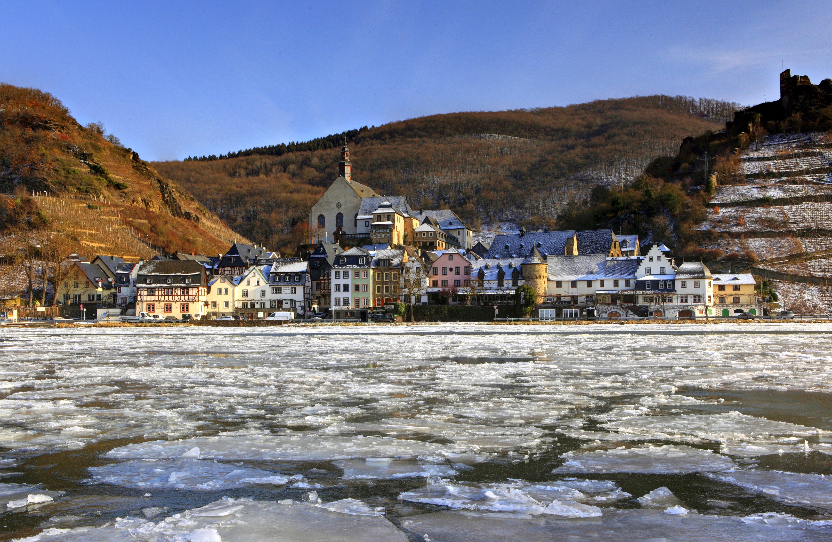 Frozen river in front of a German town with a church HD Wallpaper