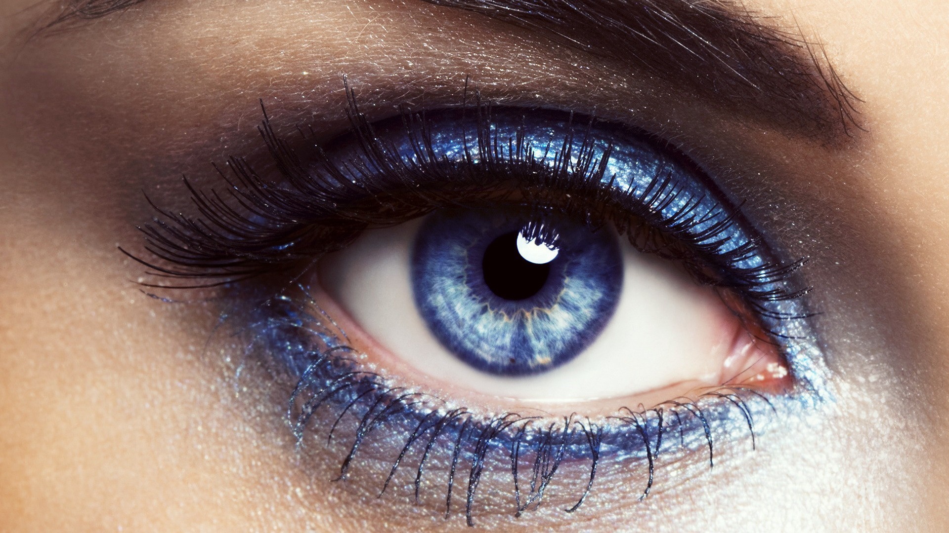 Close-up of a blue eye with dramatic makeup HD Wallpaper
