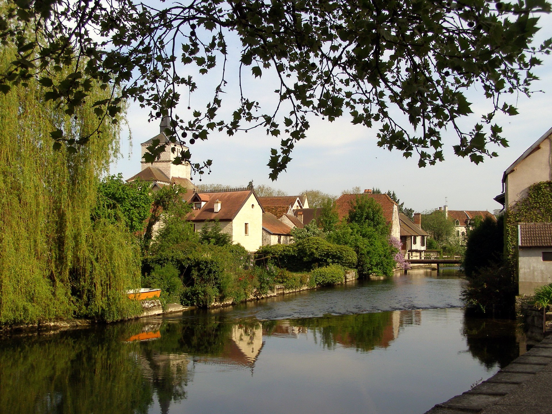 Village with church and river in France HD Wallpaper