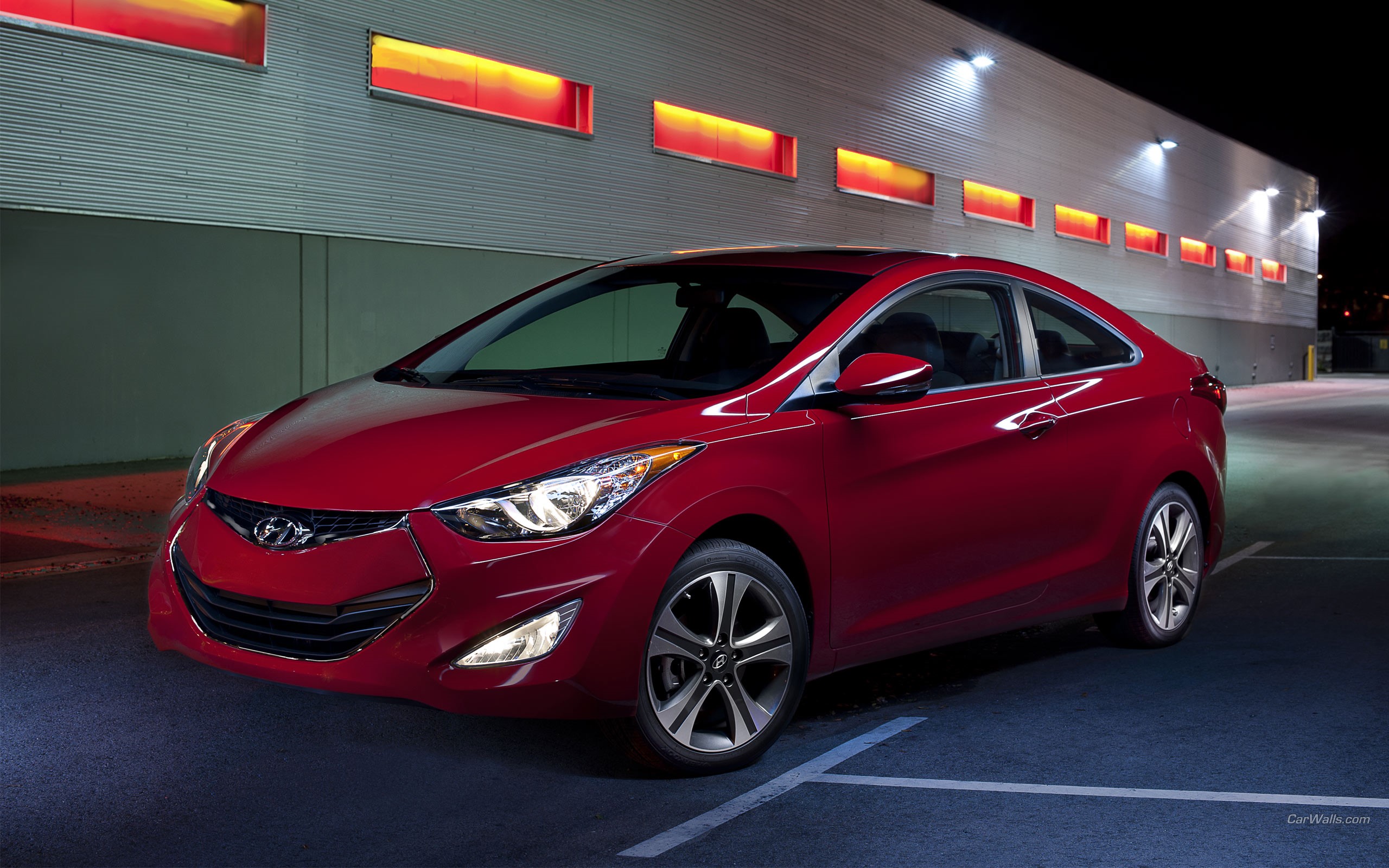 Red Hyundai Elantra Coupe parked at night HD Wallpaper