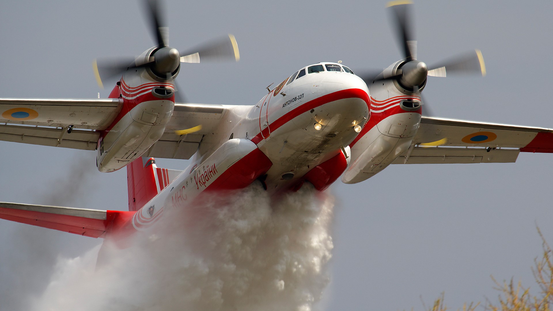 Antonov An-32 aircraft spraying water HD Wallpaper