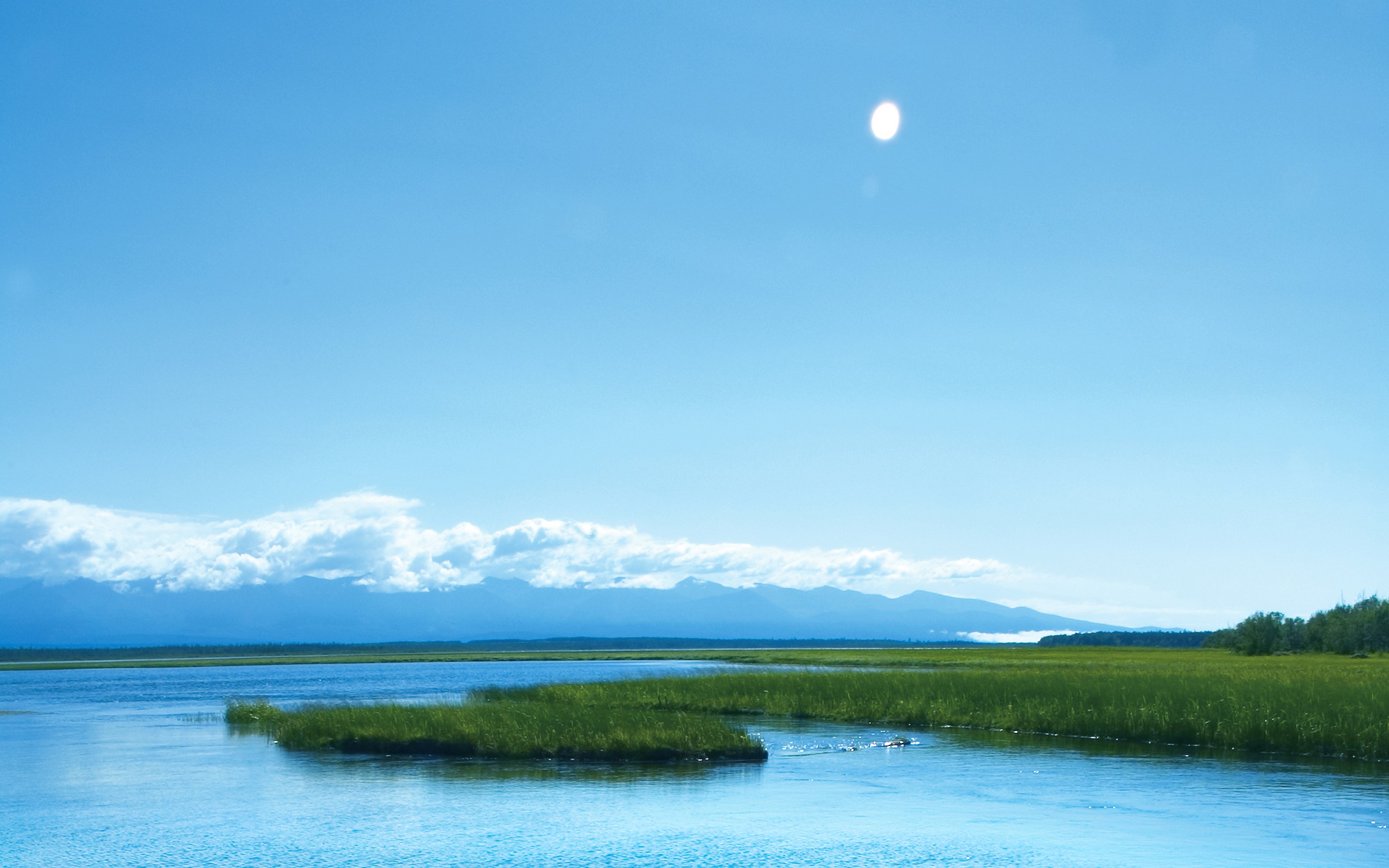 River and marshland with mountains in the background HD Wallpaper