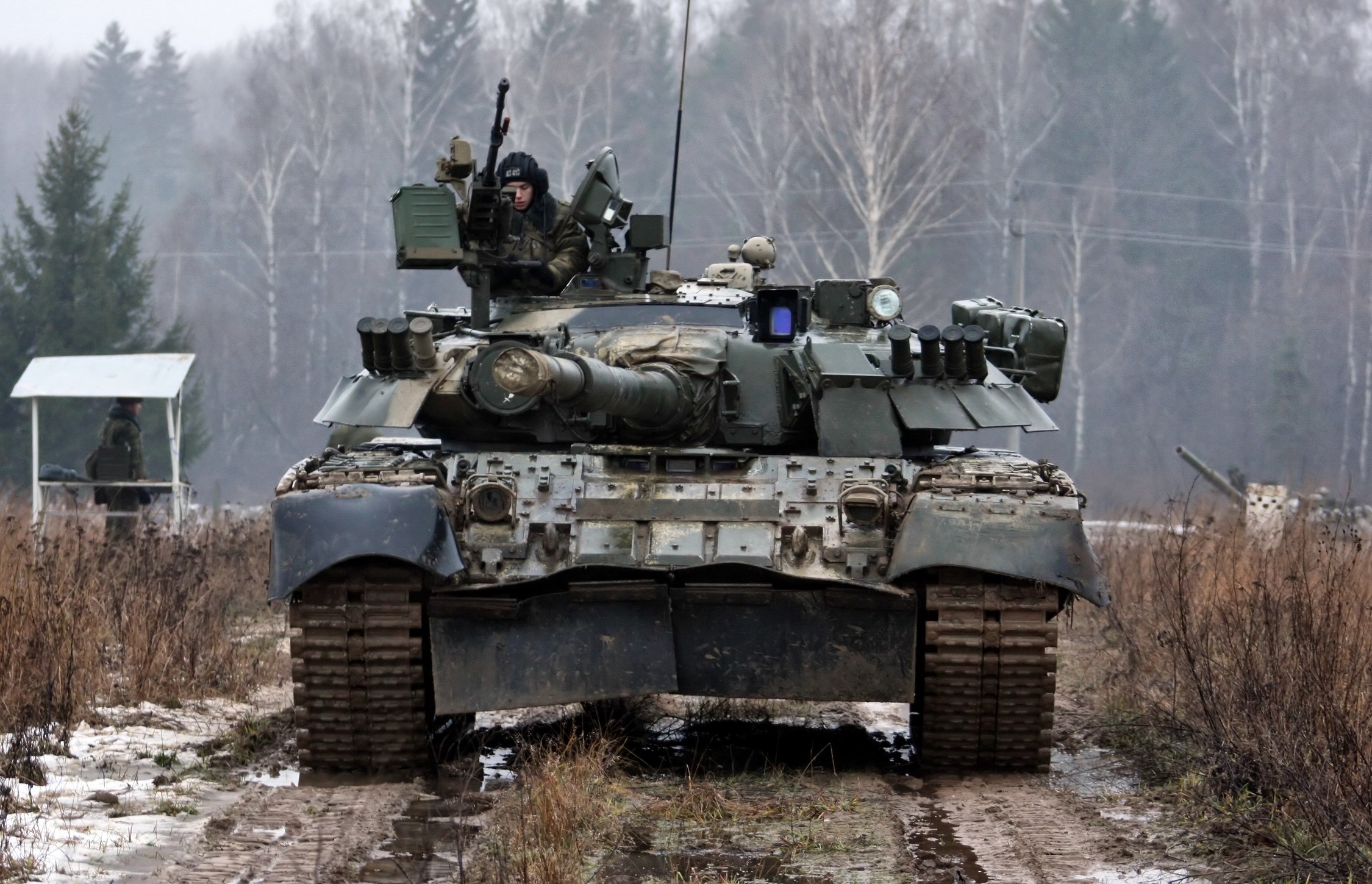 Tank with soldier in a wooded area HD Wallpaper