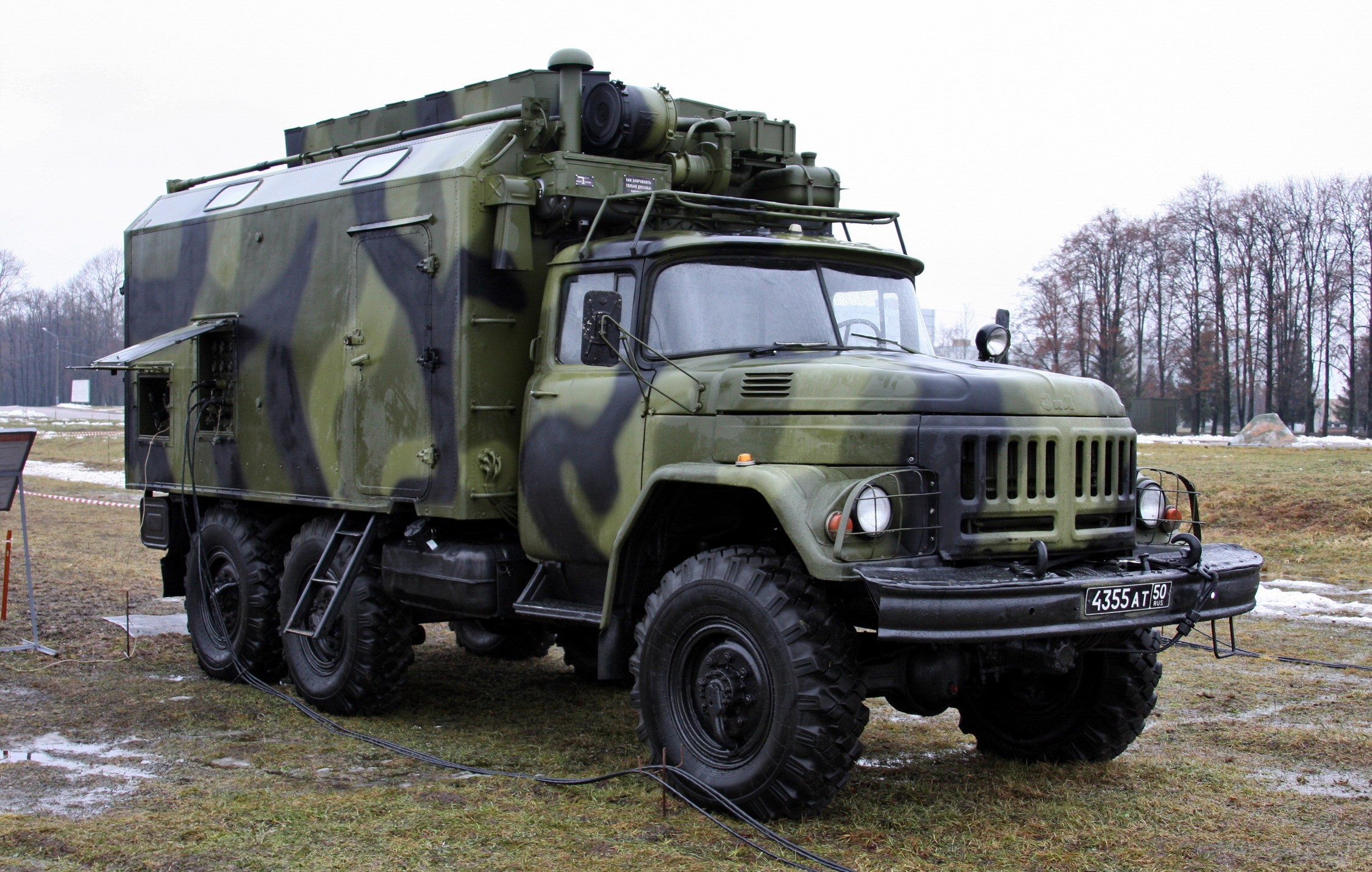 Military truck with camouflage pattern HD Wallpaper